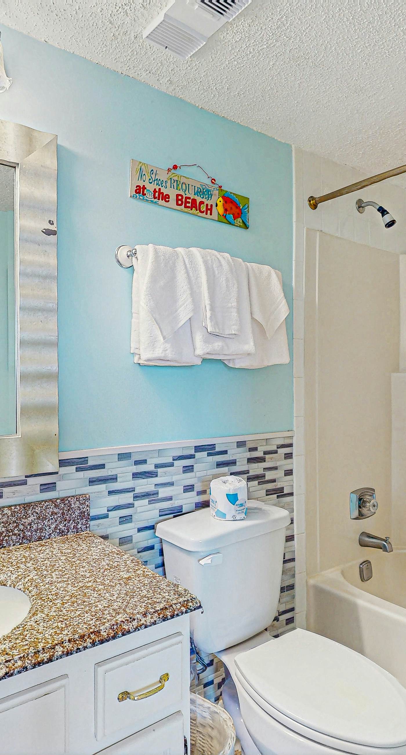 Beachfront condo with enclosed balcony, pool, views, central AC, & grill