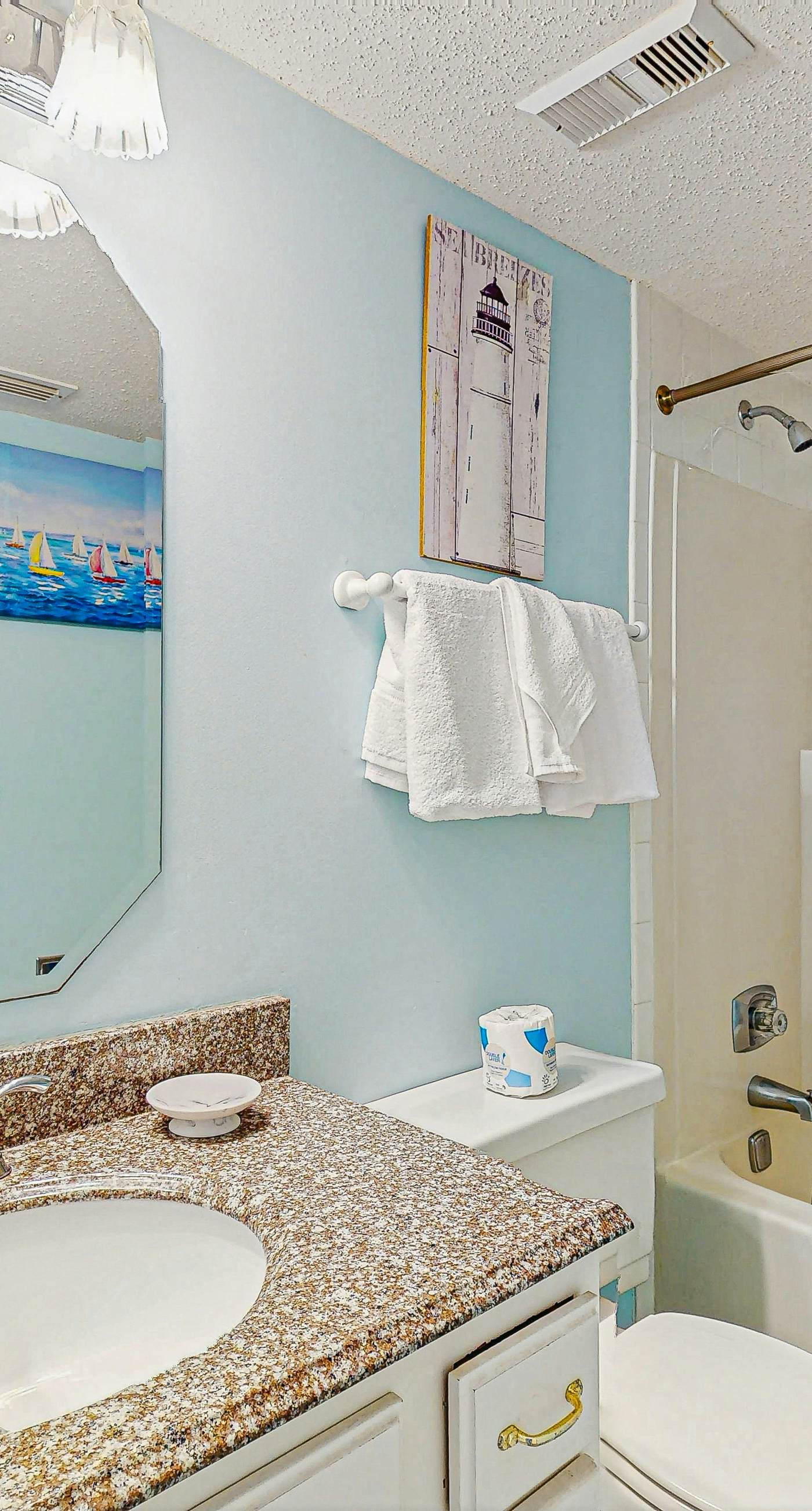 Beachfront condo with enclosed balcony, pool, views, central AC, & grill