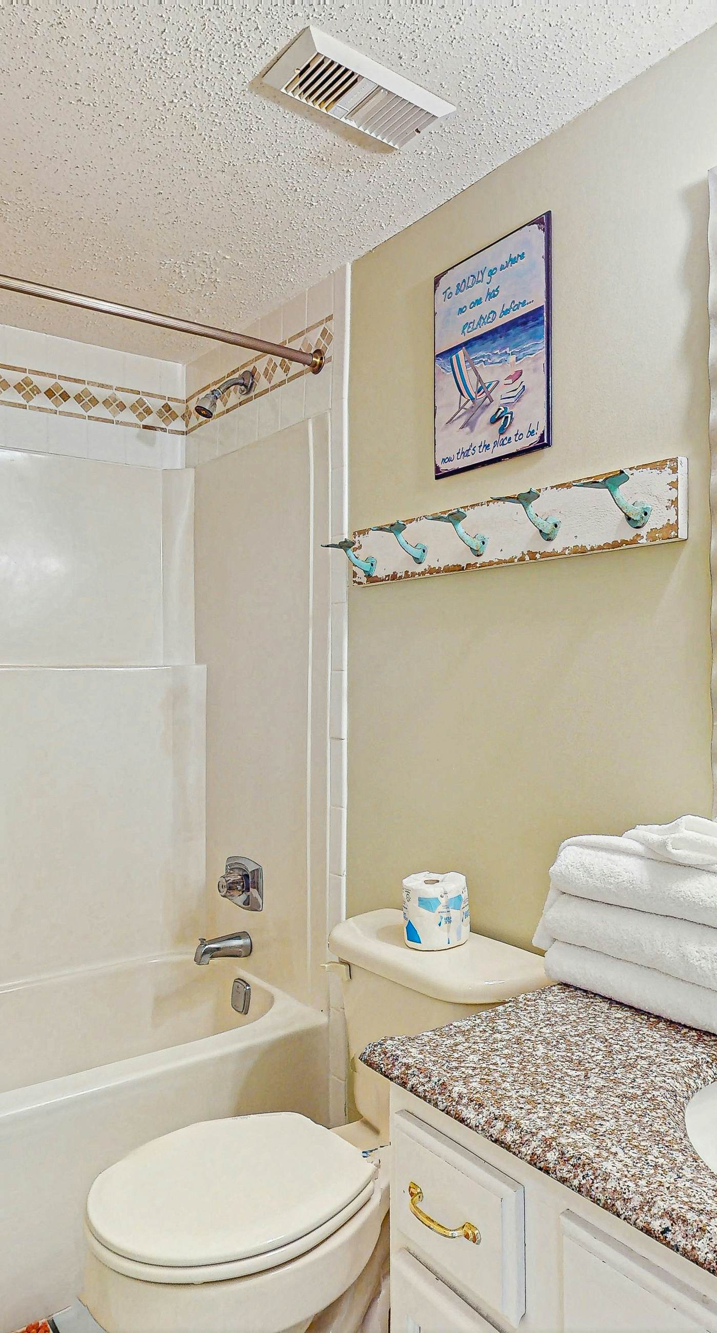 Beachfront condo with enclosed balcony, pool, views, central AC, & grill