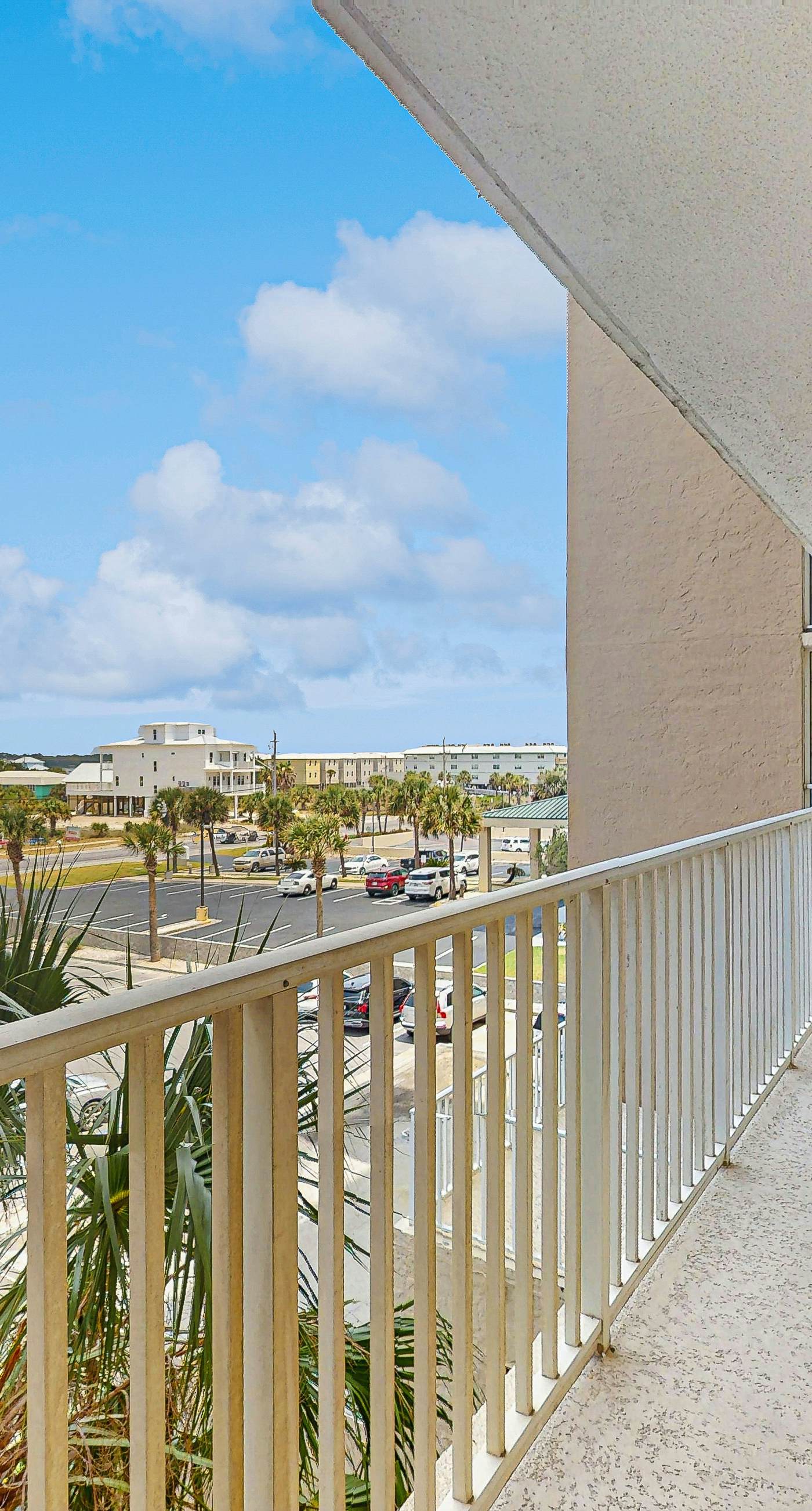 Beachfront condo with enclosed balcony, pool, views, central AC, & grill
