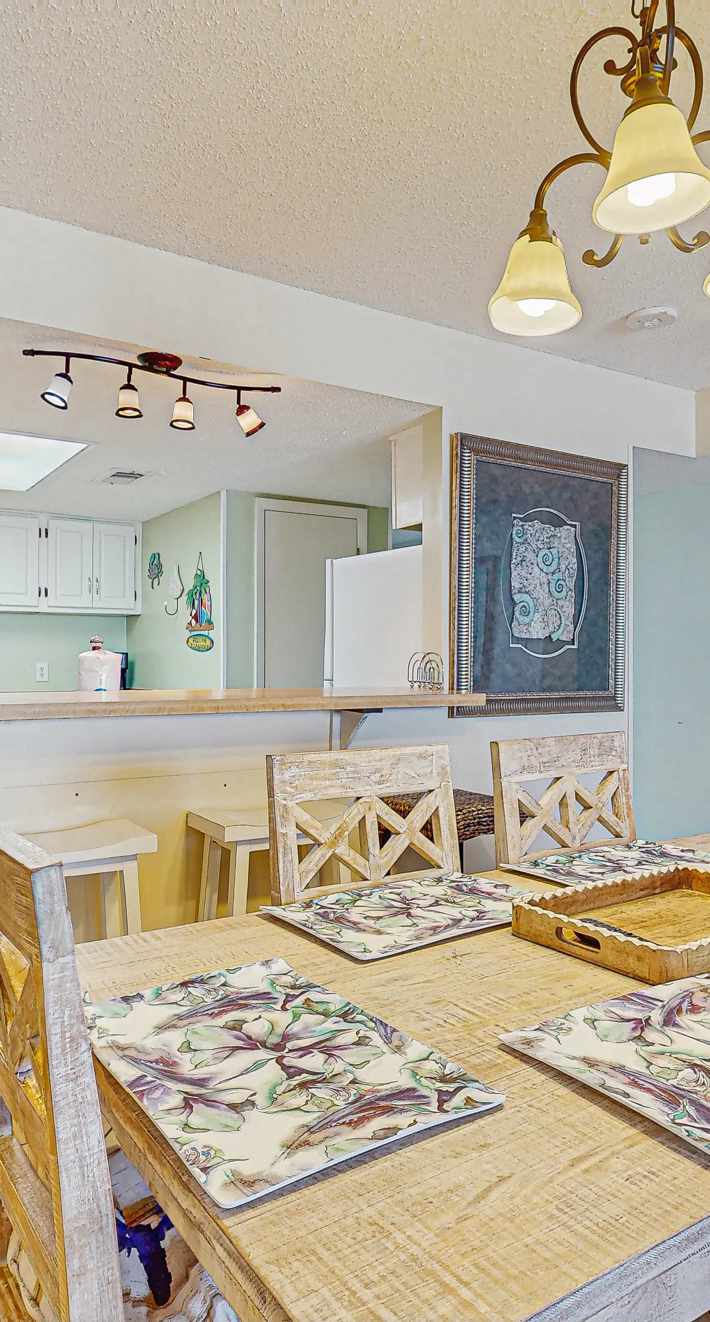 Beachfront condo with enclosed balcony, pool, views, central AC, & grill