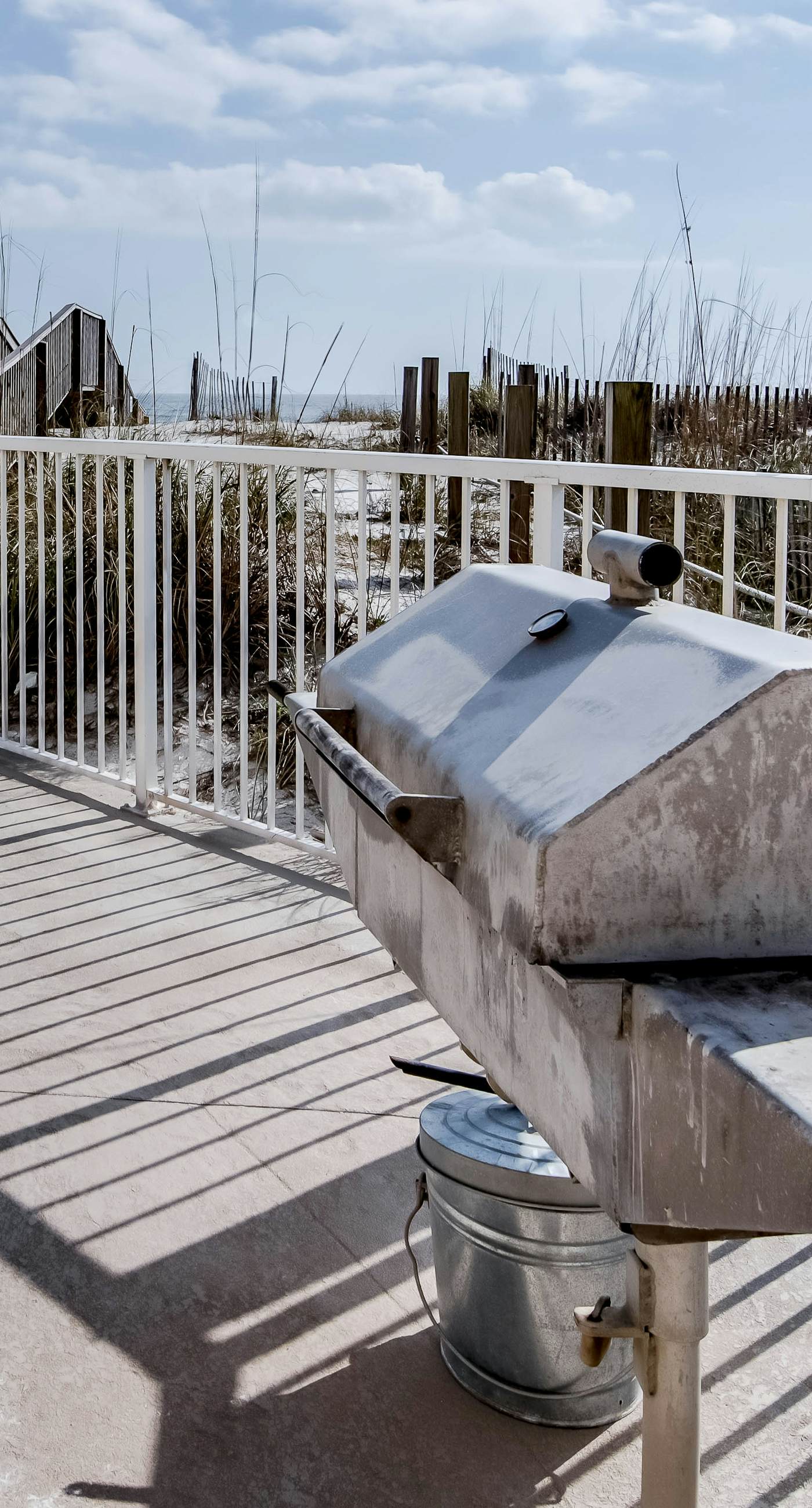 Beachfront condo with enclosed balcony, pool, views, central AC, & grill