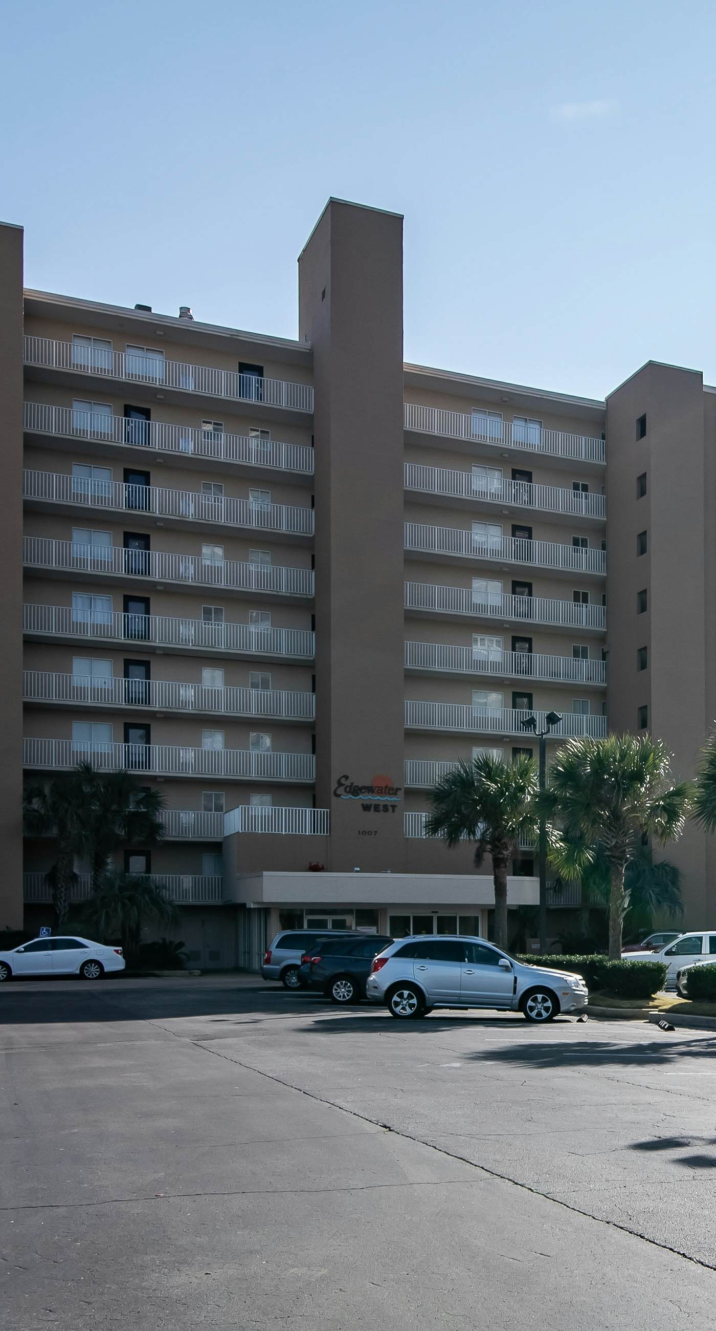 Beachfront condo with enclosed balcony, pool, views, central AC, & grill