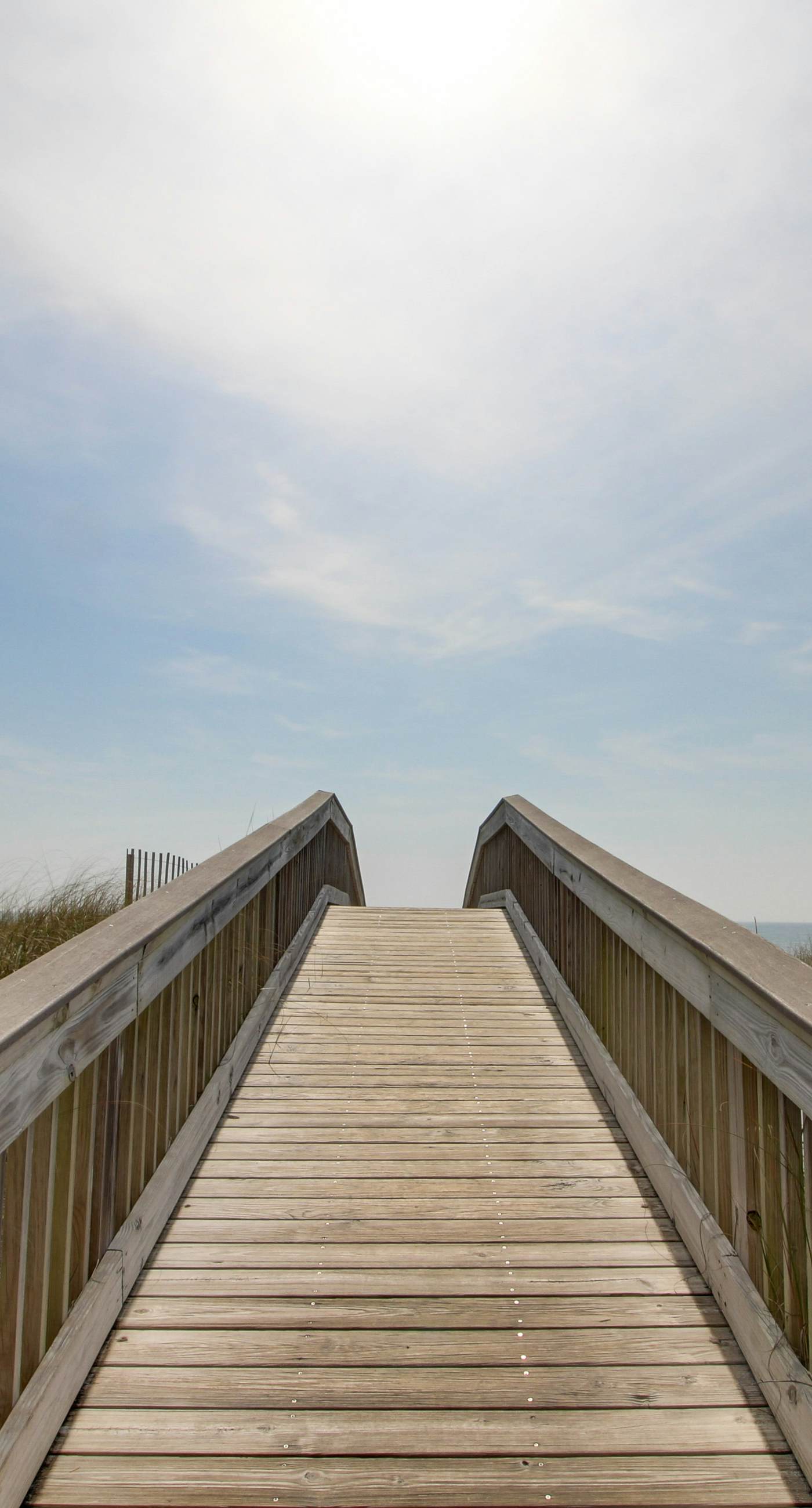 Beachfront condo with enclosed balcony, pool, views, central AC, & grill