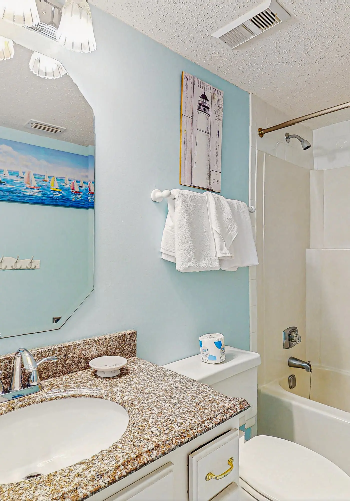 Beachfront condo with enclosed balcony, pool, views, central AC, & grill