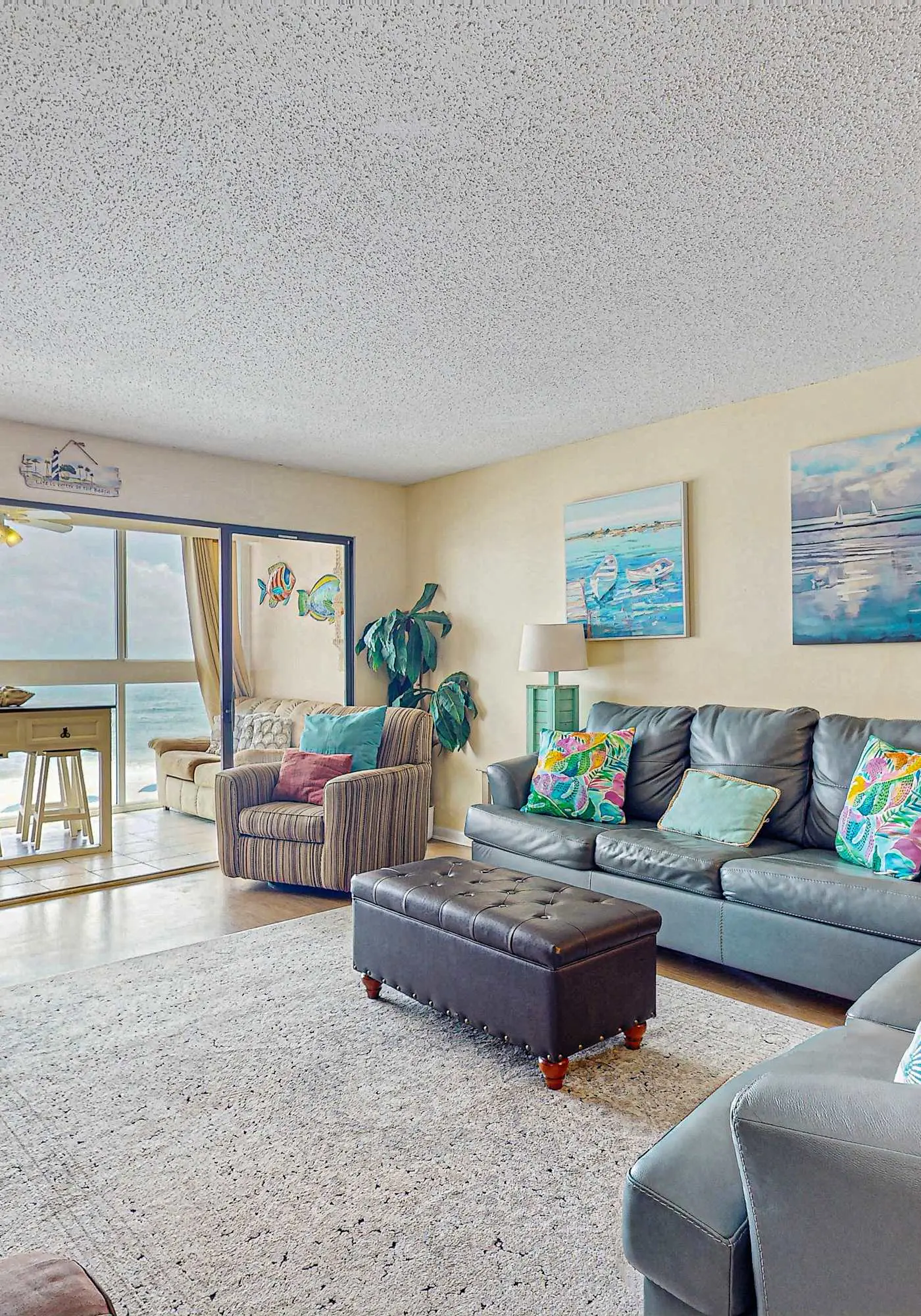 Beachfront condo with enclosed balcony, pool, views, central AC, & grill