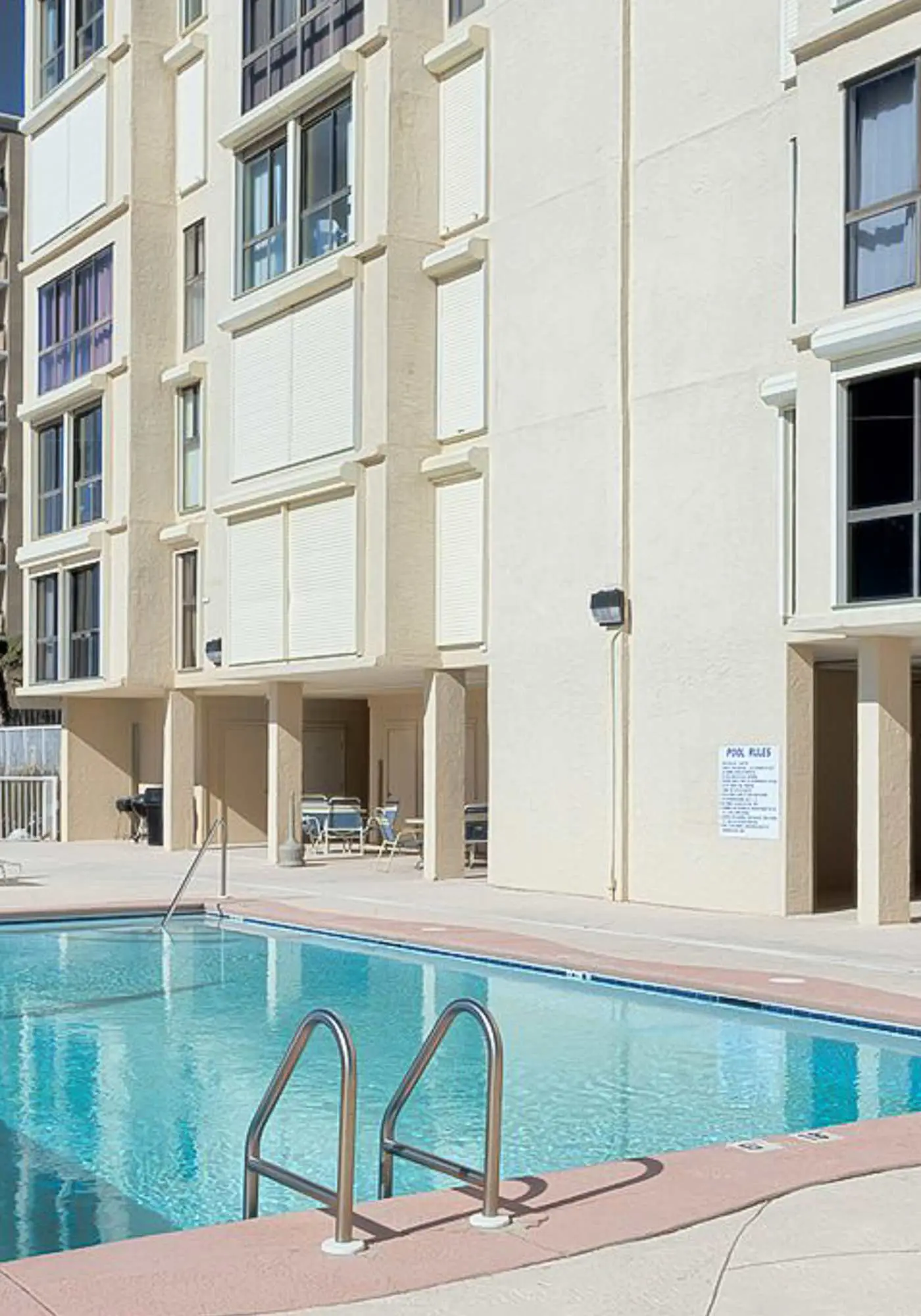 Beachfront condo with enclosed balcony, pool, views, central AC, & grill