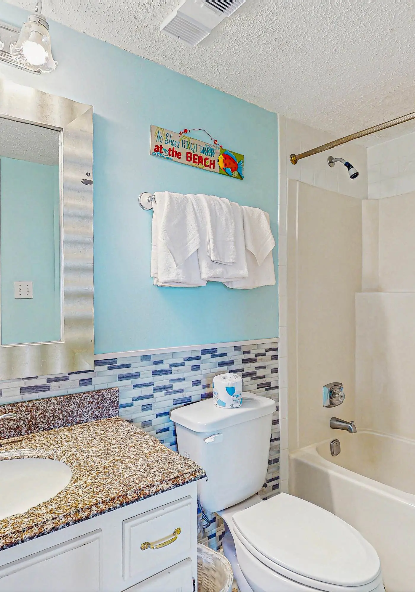 Beachfront condo with enclosed balcony, pool, views, central AC, & grill