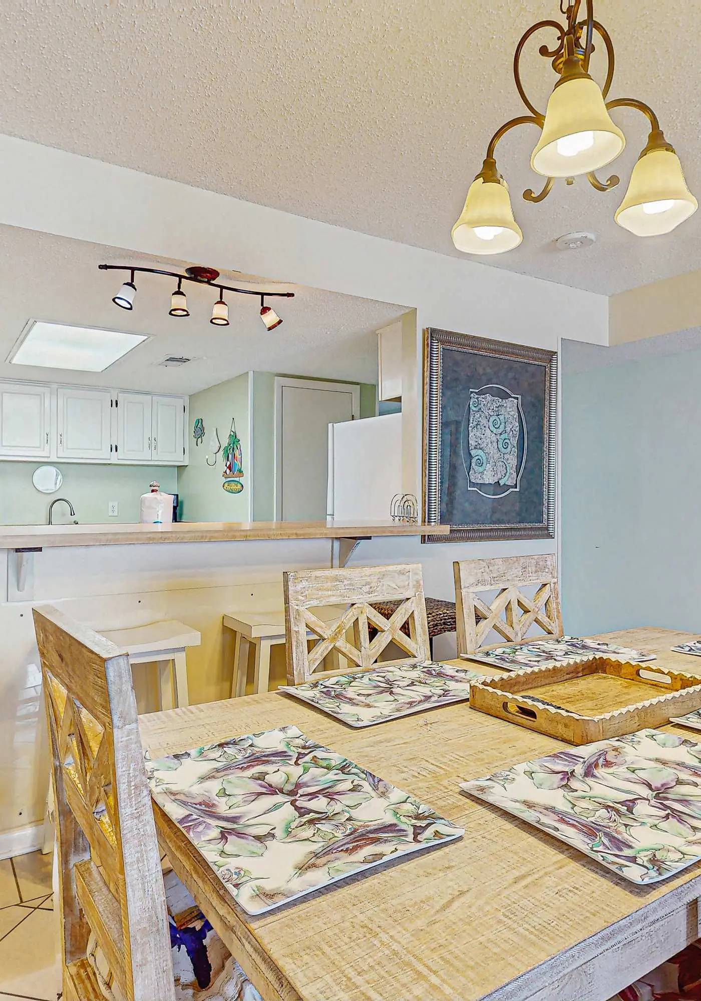 Beachfront condo with enclosed balcony, pool, views, central AC, & grill