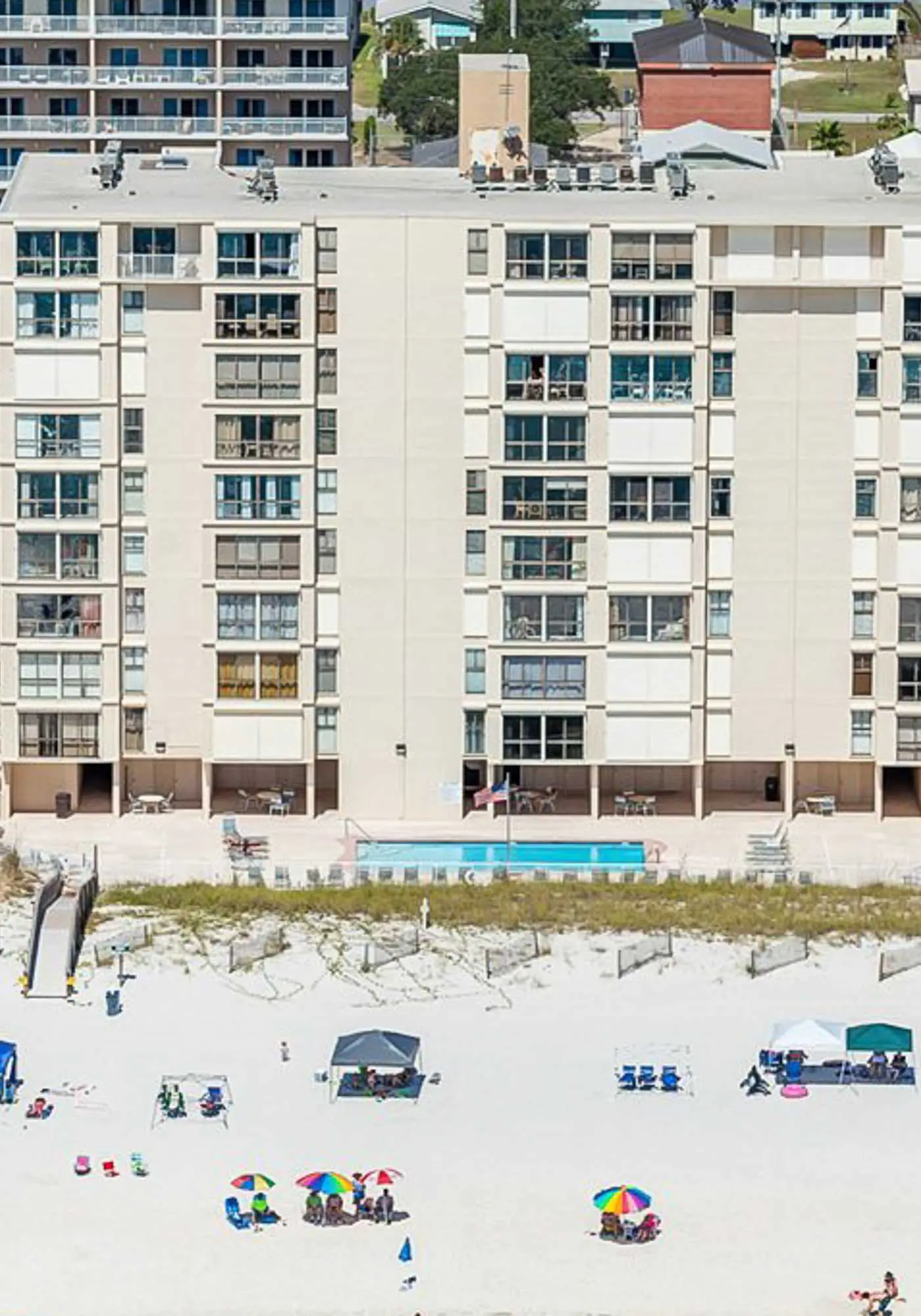 Beachfront condo with enclosed balcony, pool, views, central AC, & grill