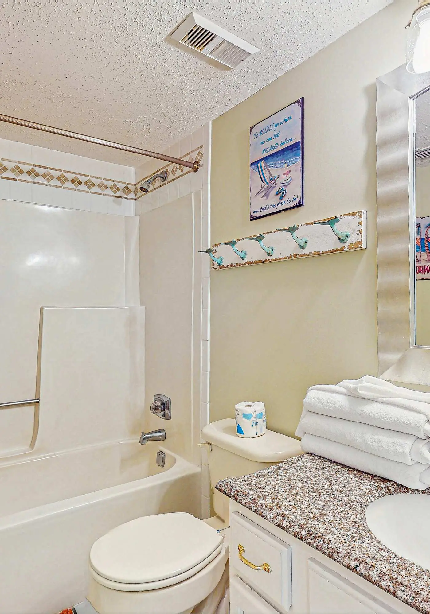 Beachfront condo with enclosed balcony, pool, views, central AC, & grill