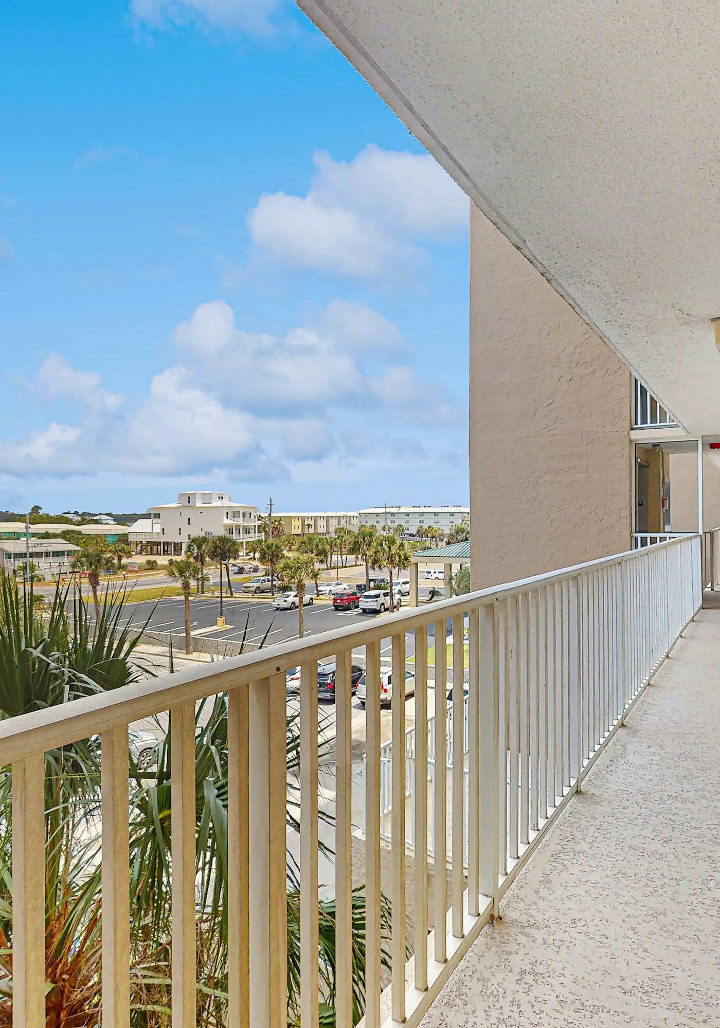 Beachfront condo with enclosed balcony, pool, views, central AC, & grill