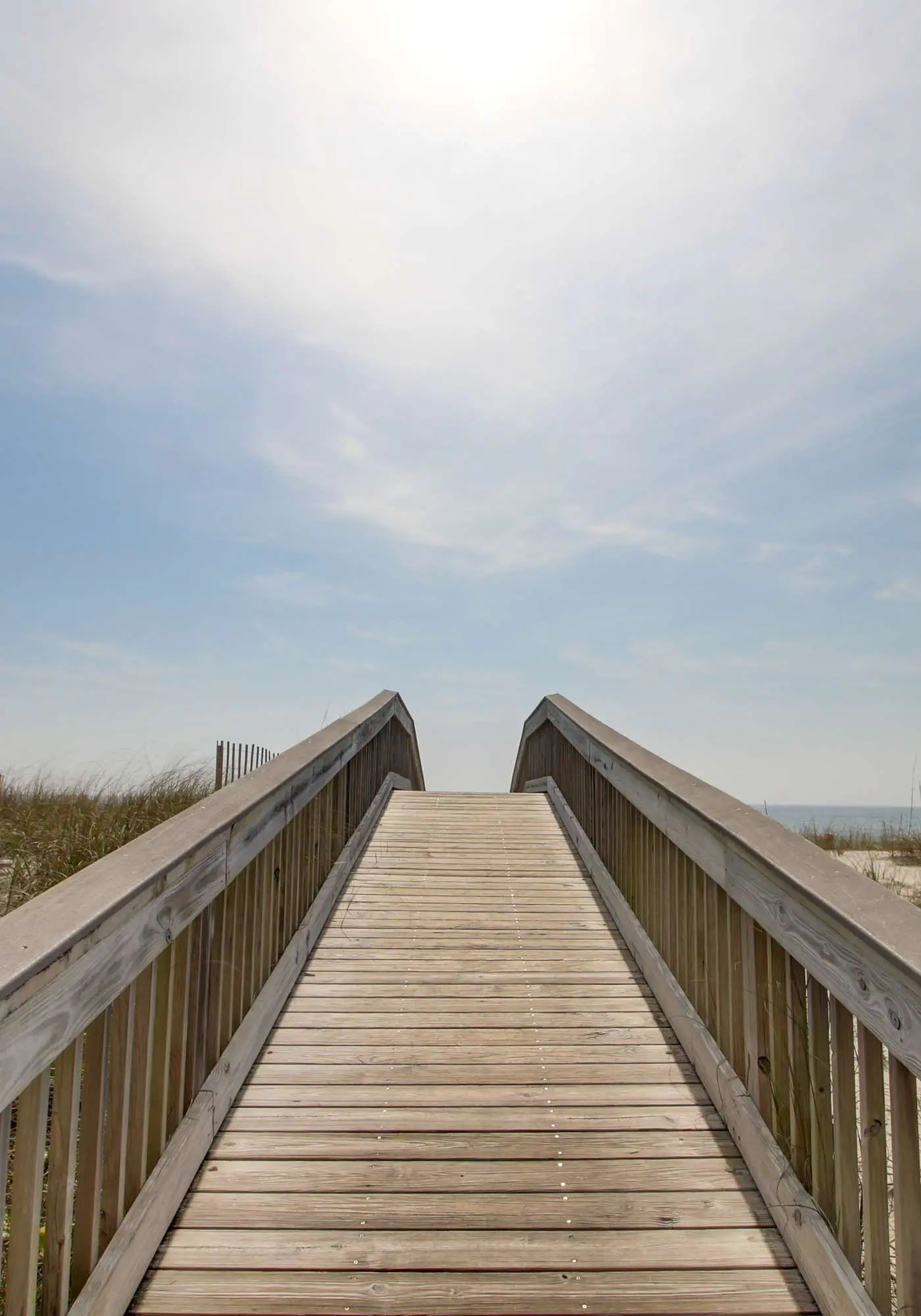 Beachfront condo with enclosed balcony, pool, views, central AC, & grill