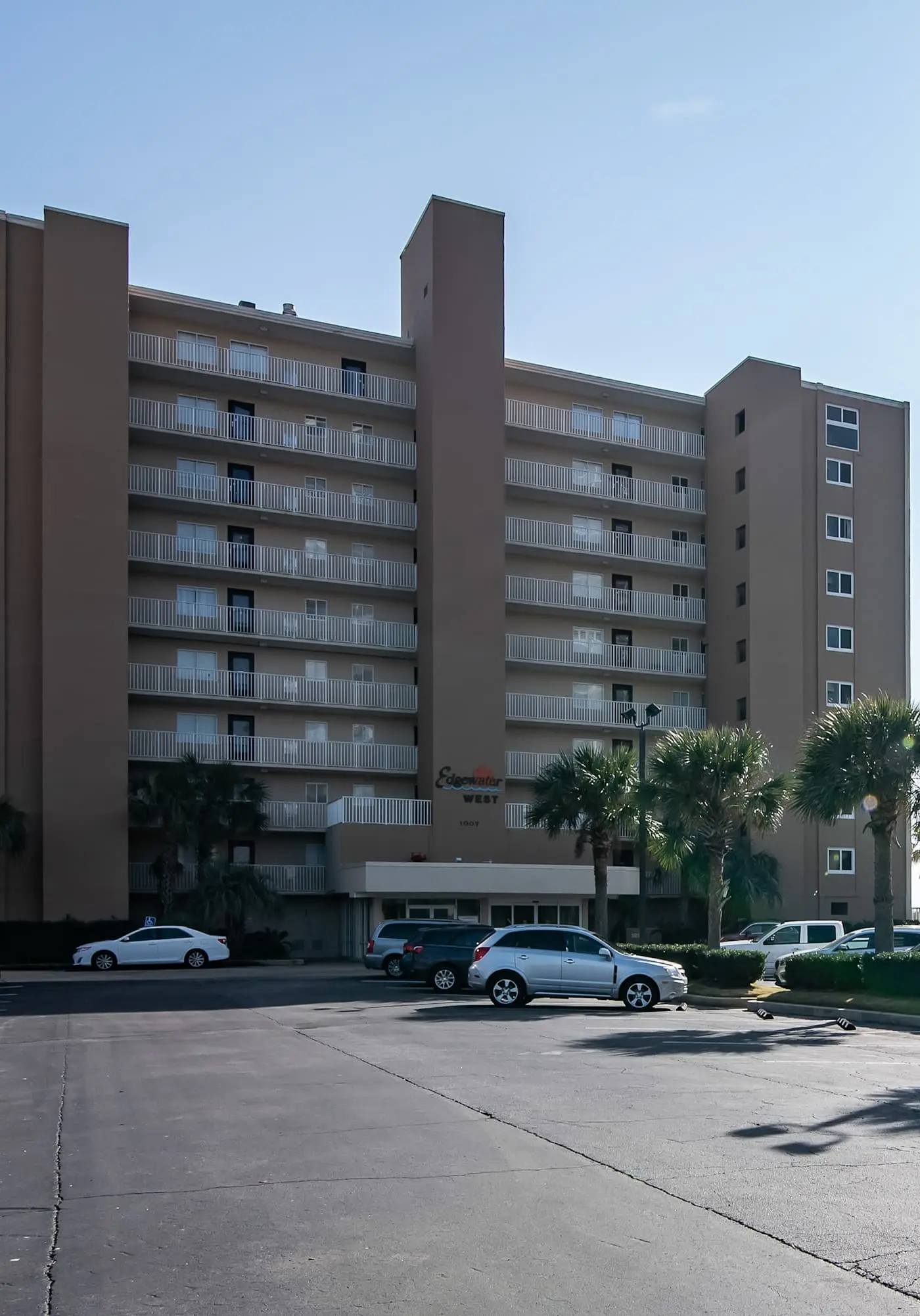 Beachfront condo with enclosed balcony, pool, views, central AC, & grill