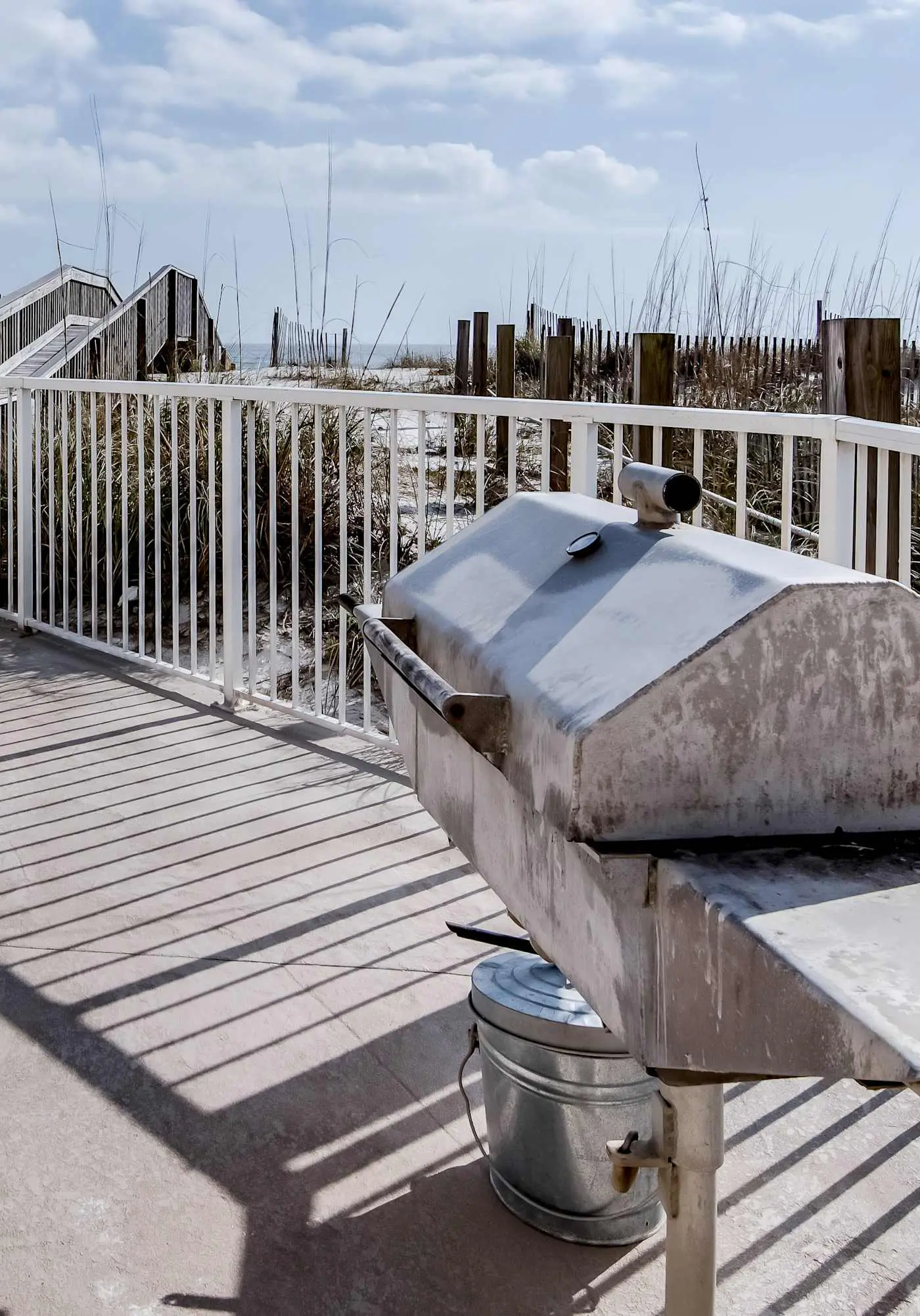 Beachfront condo with enclosed balcony, pool, views, central AC, & grill