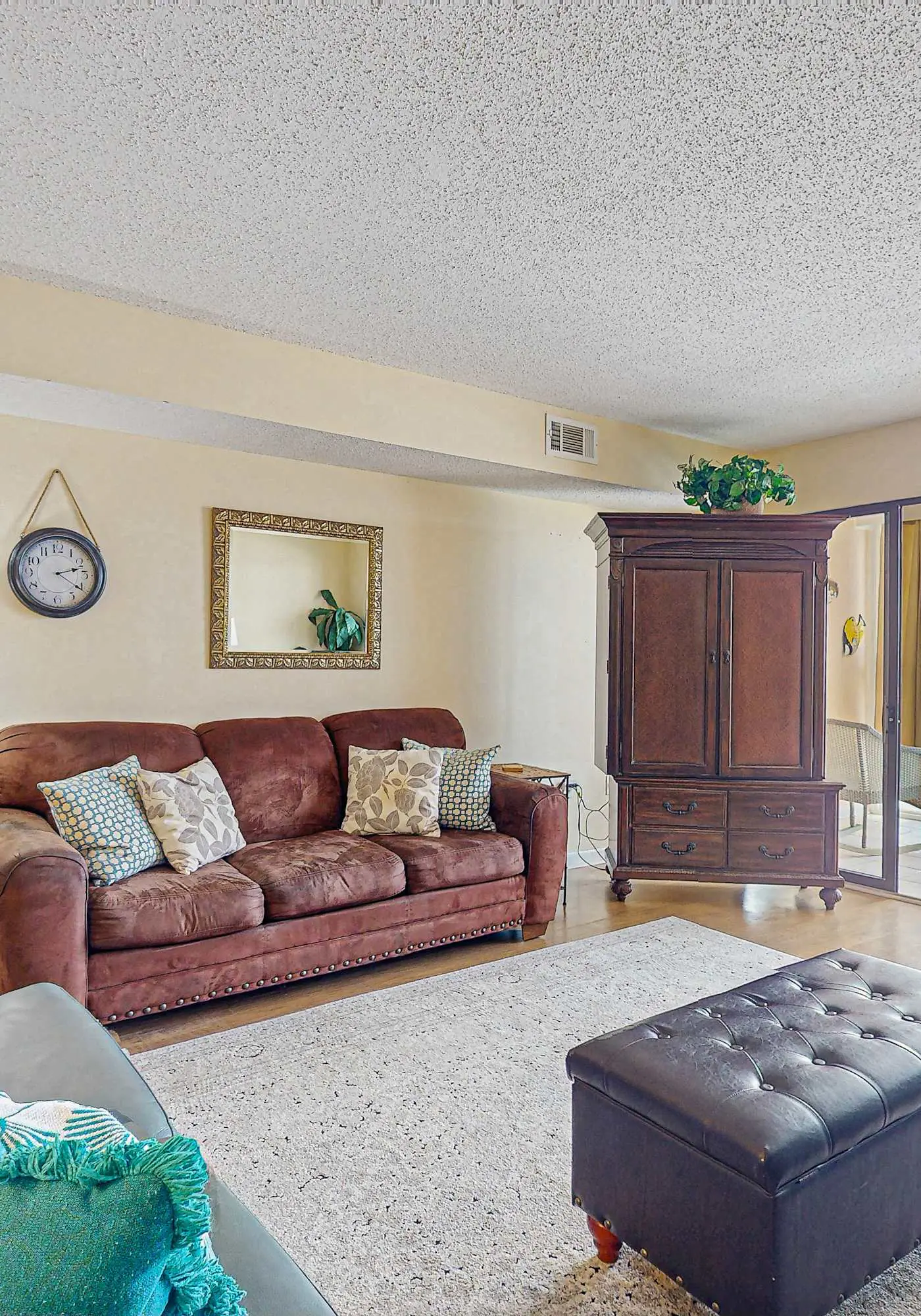 Beachfront condo with enclosed balcony, pool, views, central AC, & grill