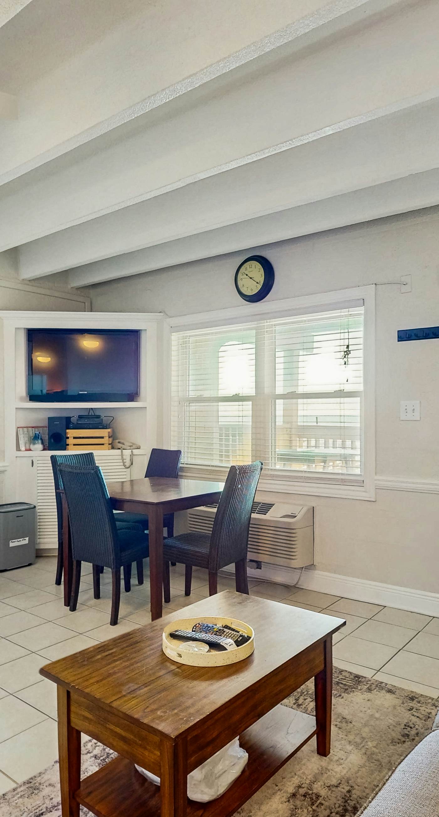 Ocean-view condo with pool access, outdoor seating, central AC & WiFi