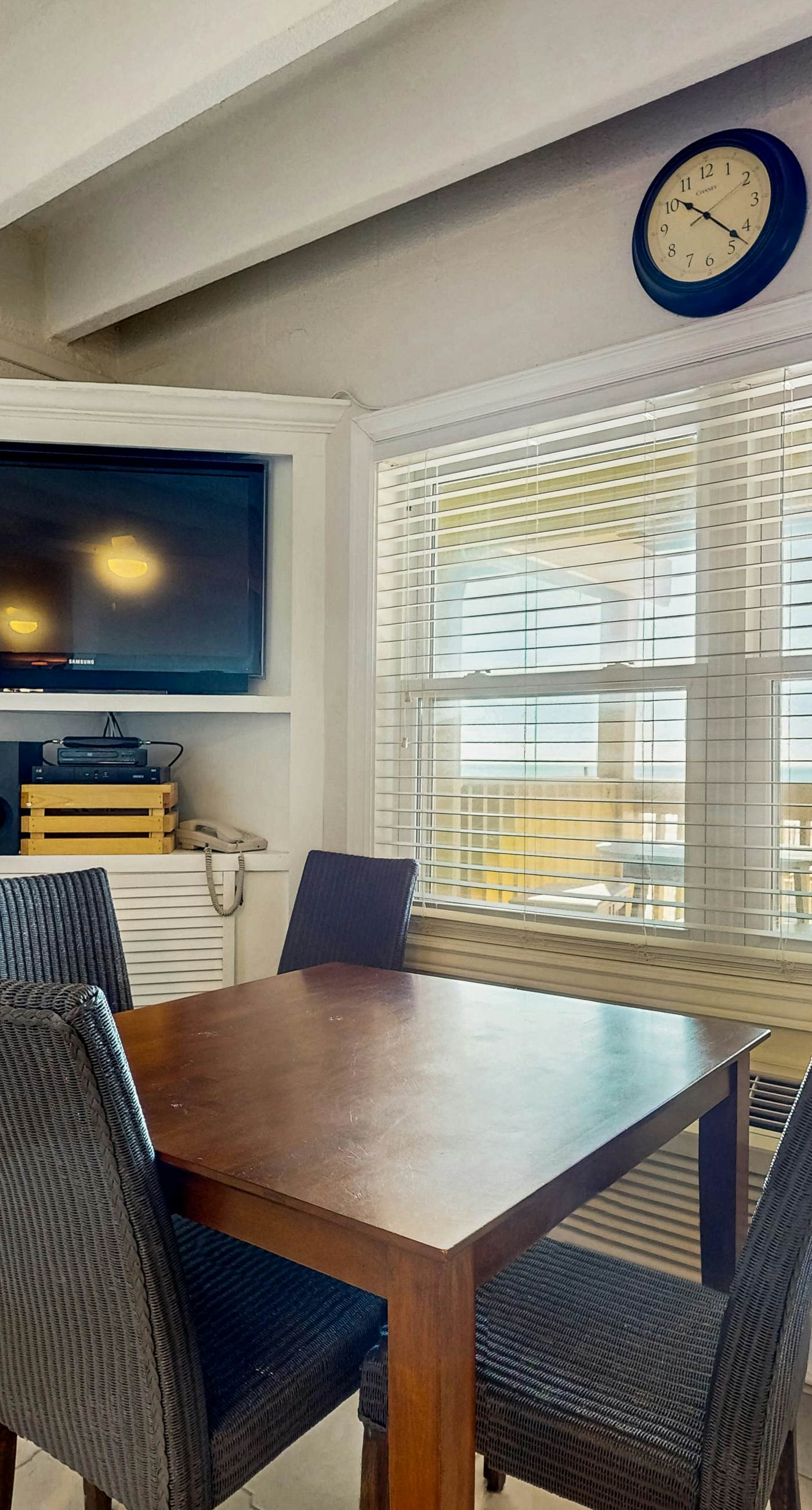 Ocean-view condo with pool access, outdoor seating, central AC & WiFi