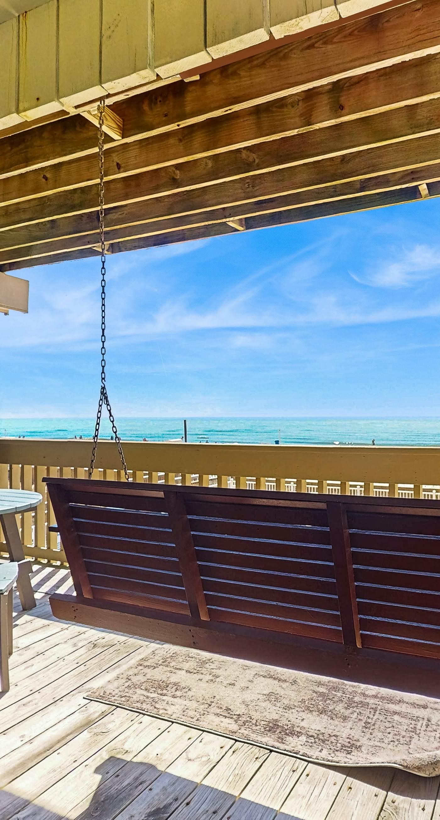 Ocean-view condo with pool access, outdoor seating, central AC & WiFi