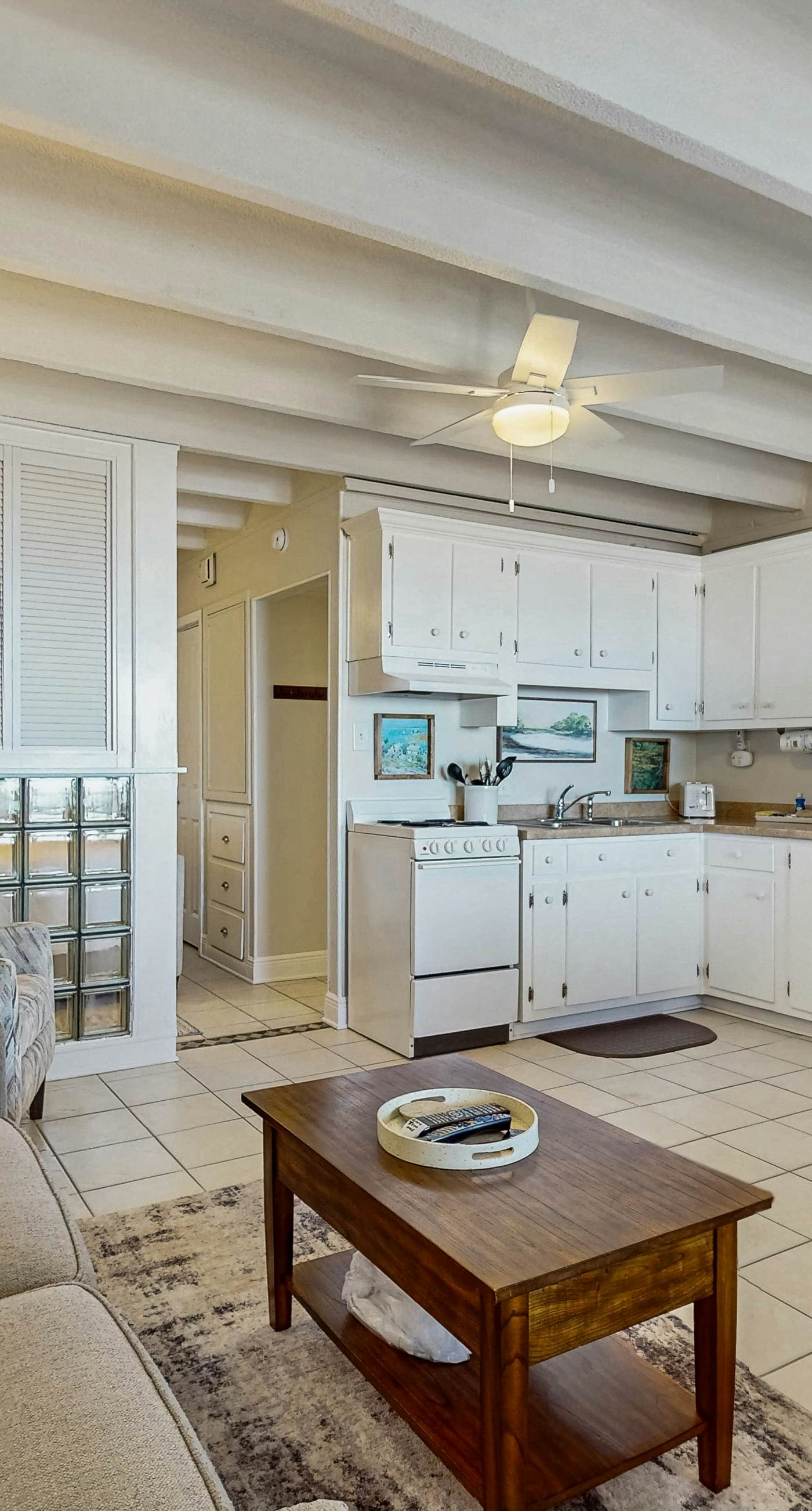 Ocean-view condo with pool access, outdoor seating, central AC & WiFi