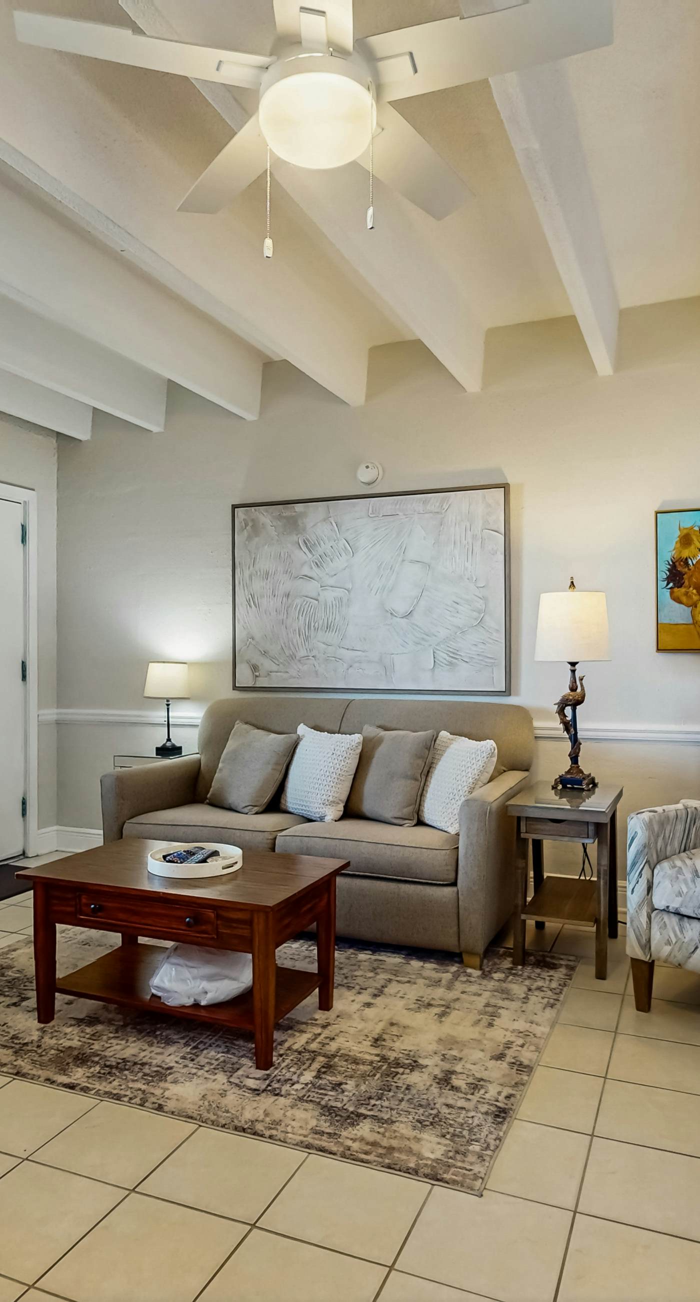 Ocean-view condo with pool access, outdoor seating, central AC & WiFi