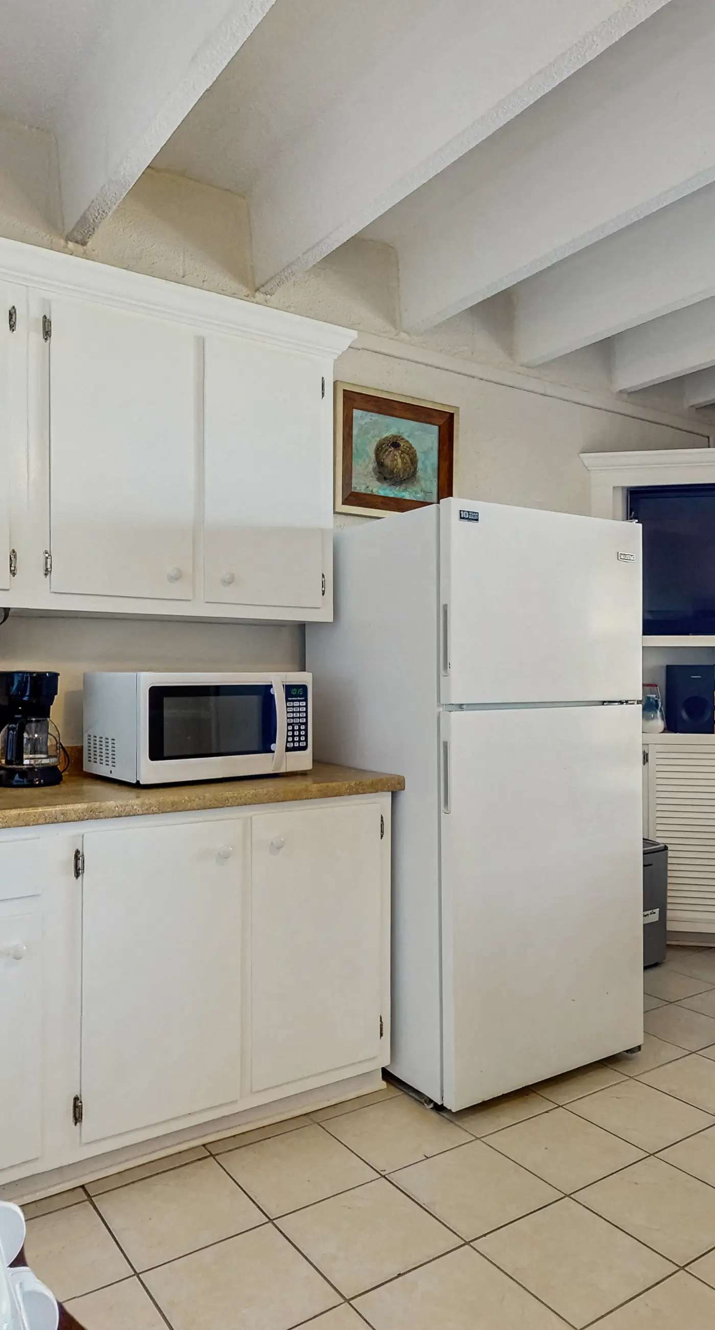 Ocean-view condo with pool access, outdoor seating, central AC & WiFi