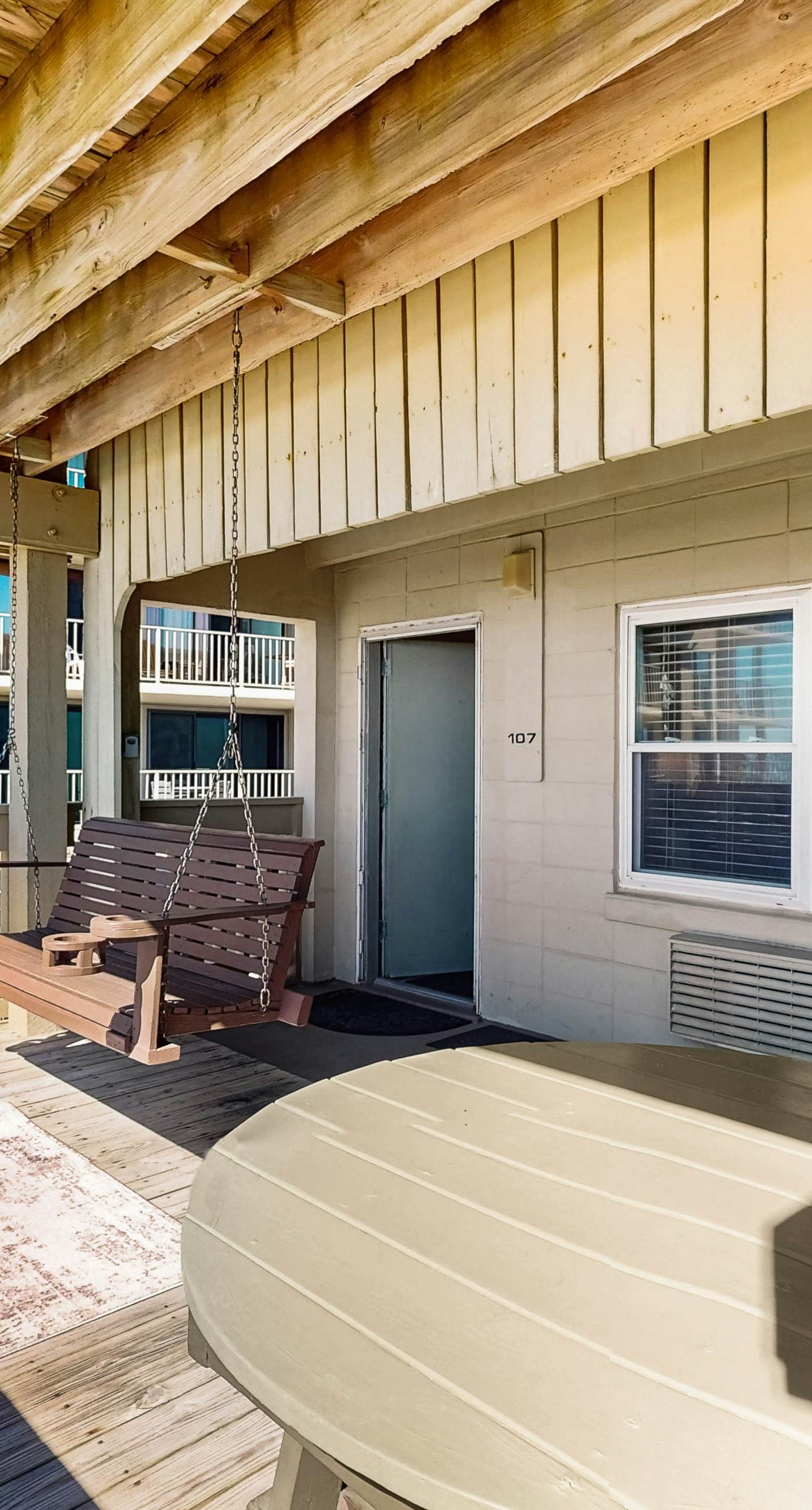 Ocean-view condo with pool access, outdoor seating, central AC & WiFi