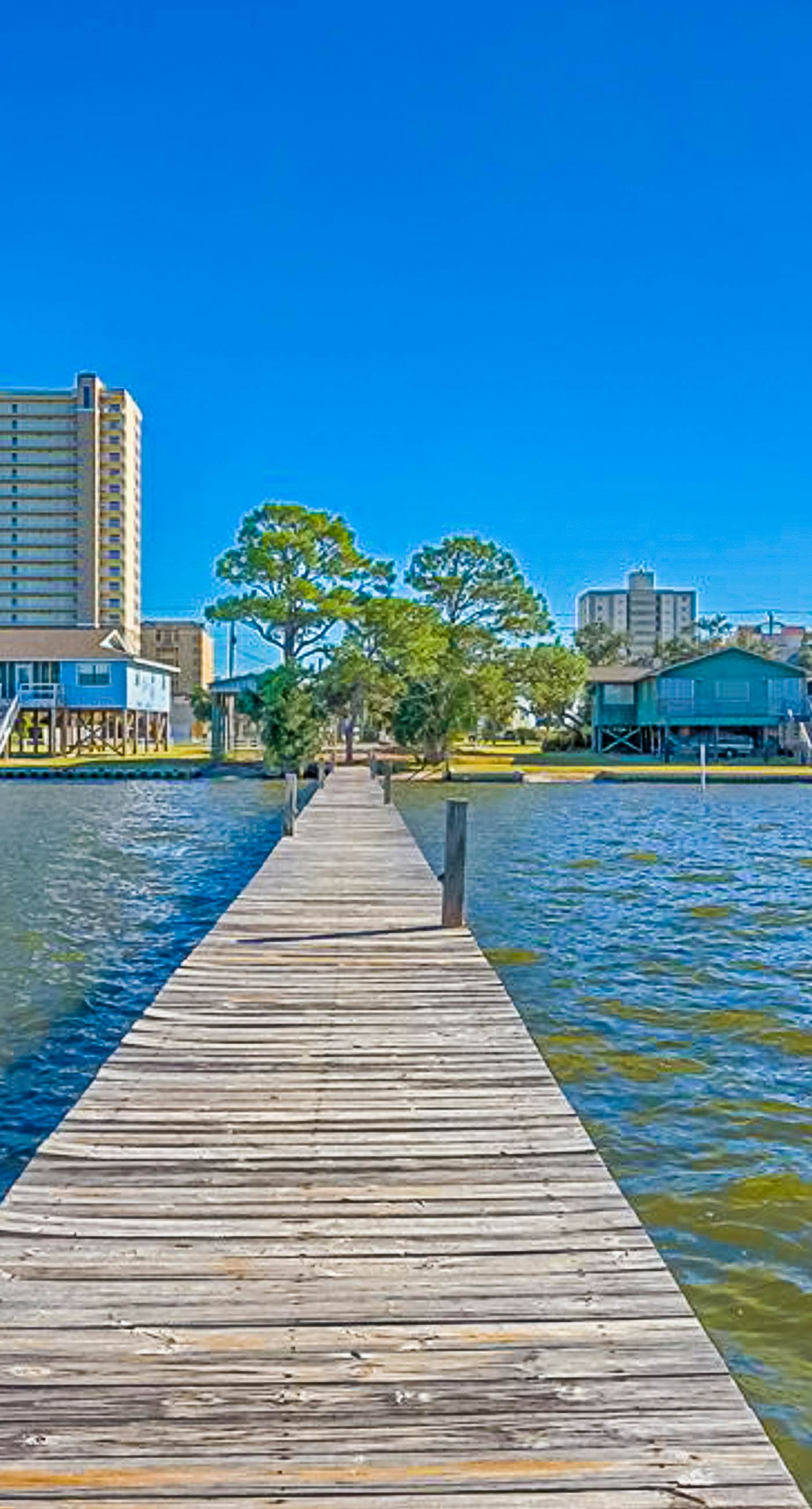 Ocean-view condo with pool access, outdoor seating, central AC & WiFi