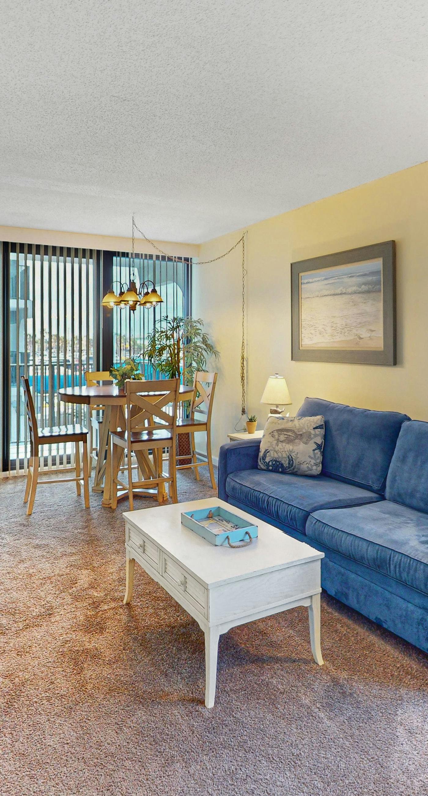 Convenient condo with balcony, beach views, pool, & central AC