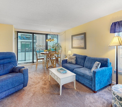 Convenient condo with balcony, beach views, pool, & central AC