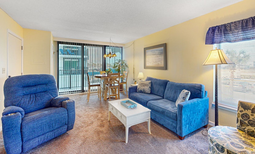 Convenient condo with balcony, beach views, pool, & central AC