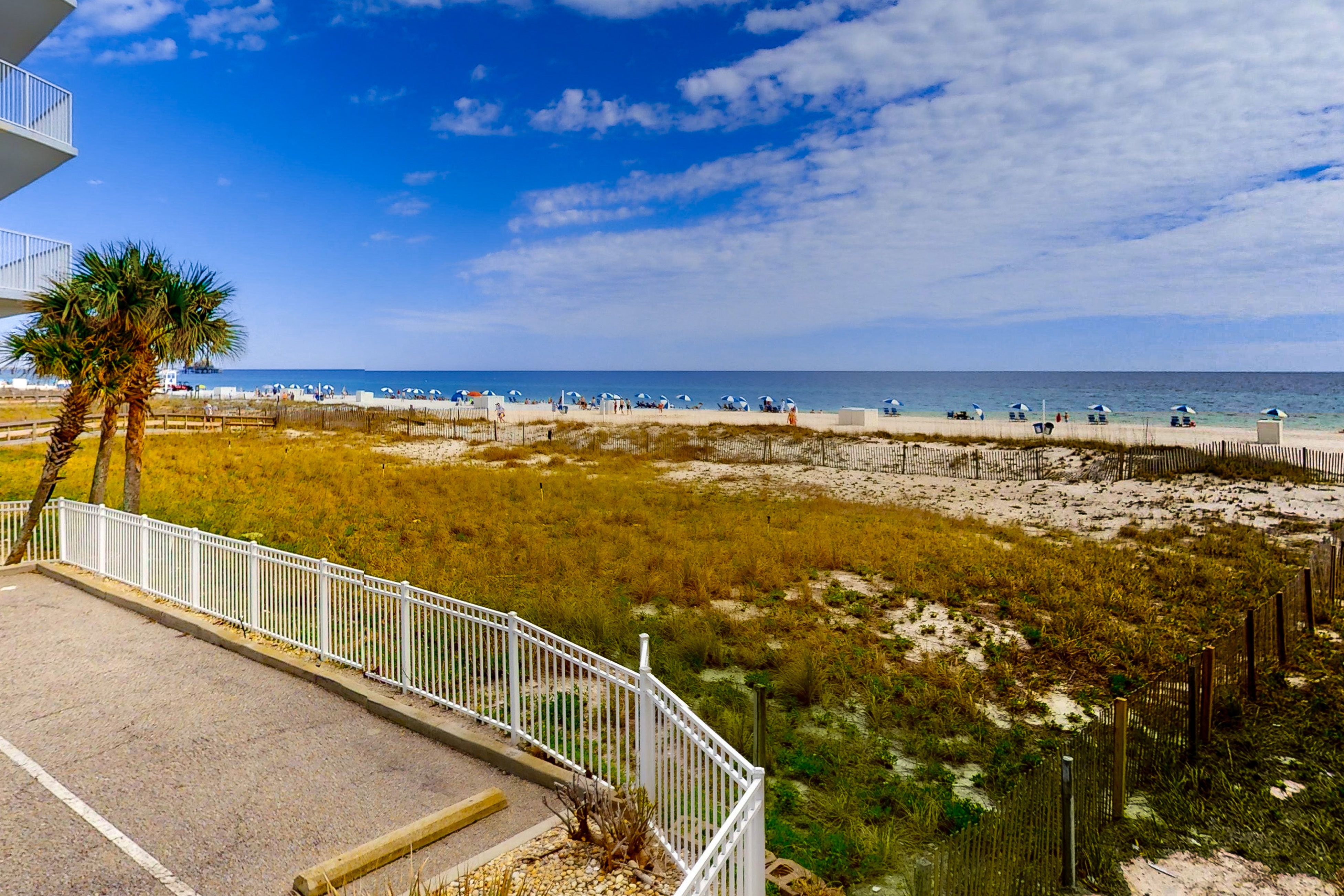 Convenient condo with balcony, beach views, pool, & central AC