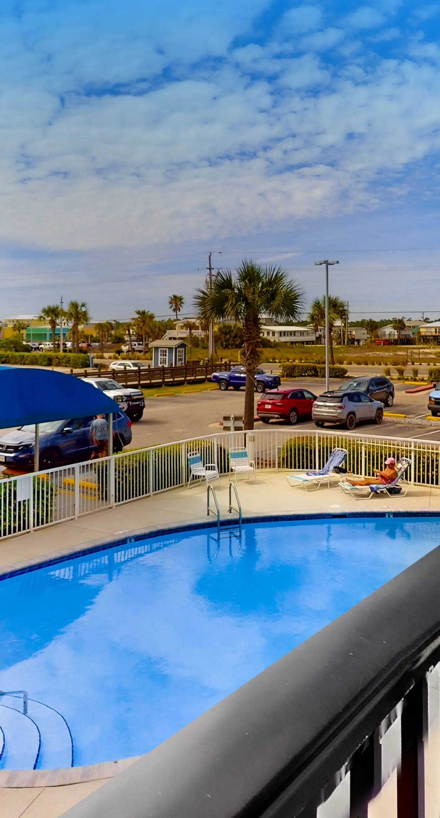 Convenient condo with balcony, beach views, pool, & central AC