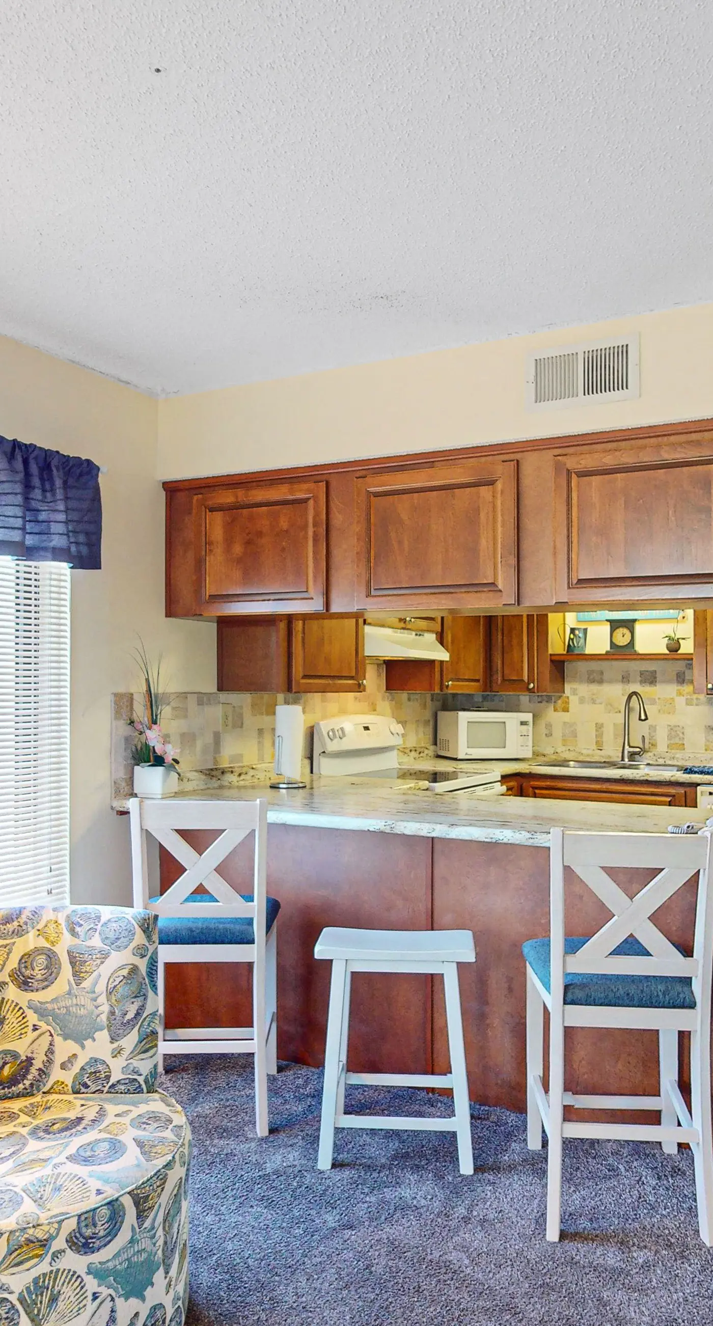 Convenient condo with balcony, beach views, pool, & central AC