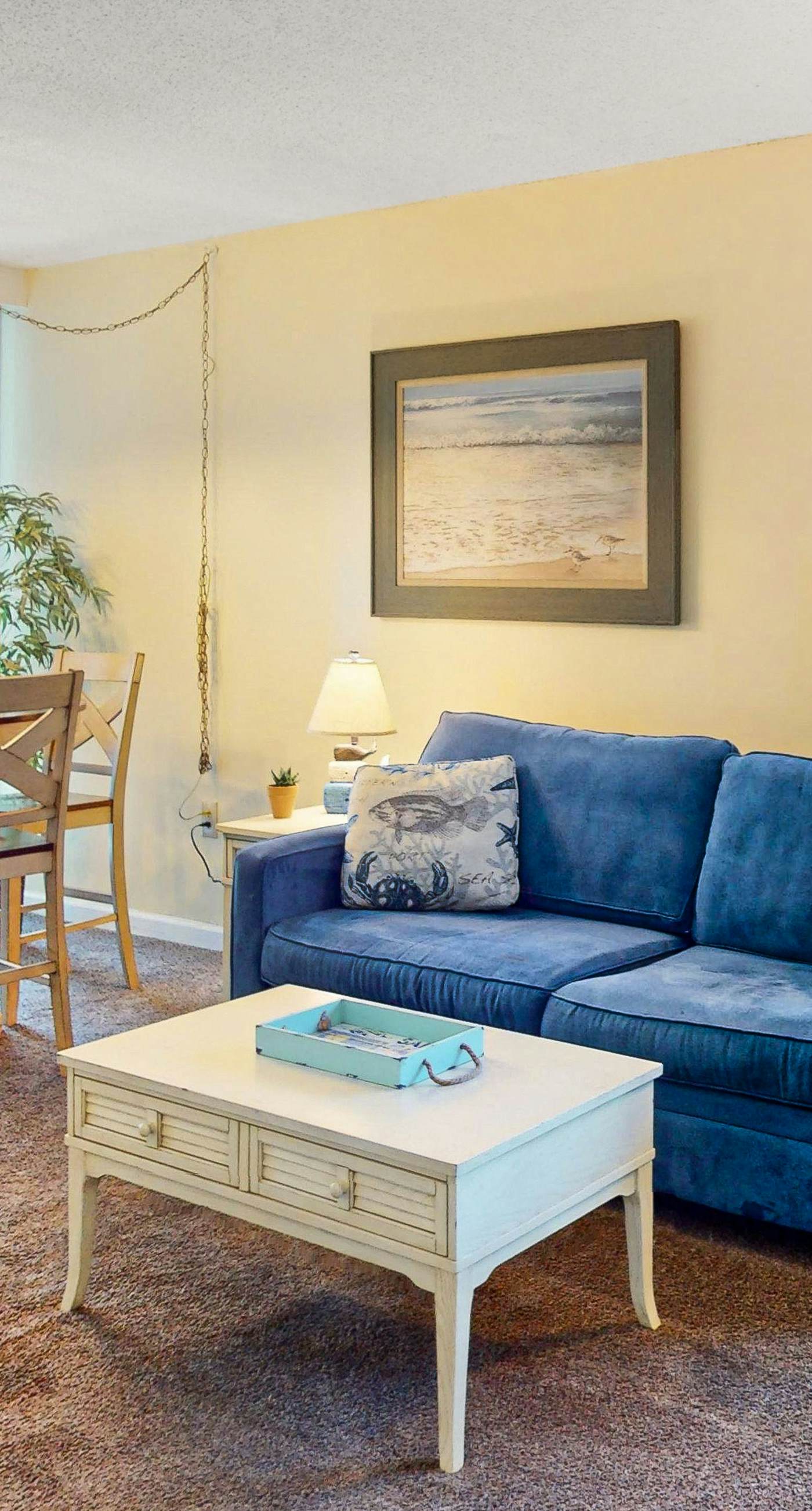 Convenient condo with balcony, beach views, pool, & central AC