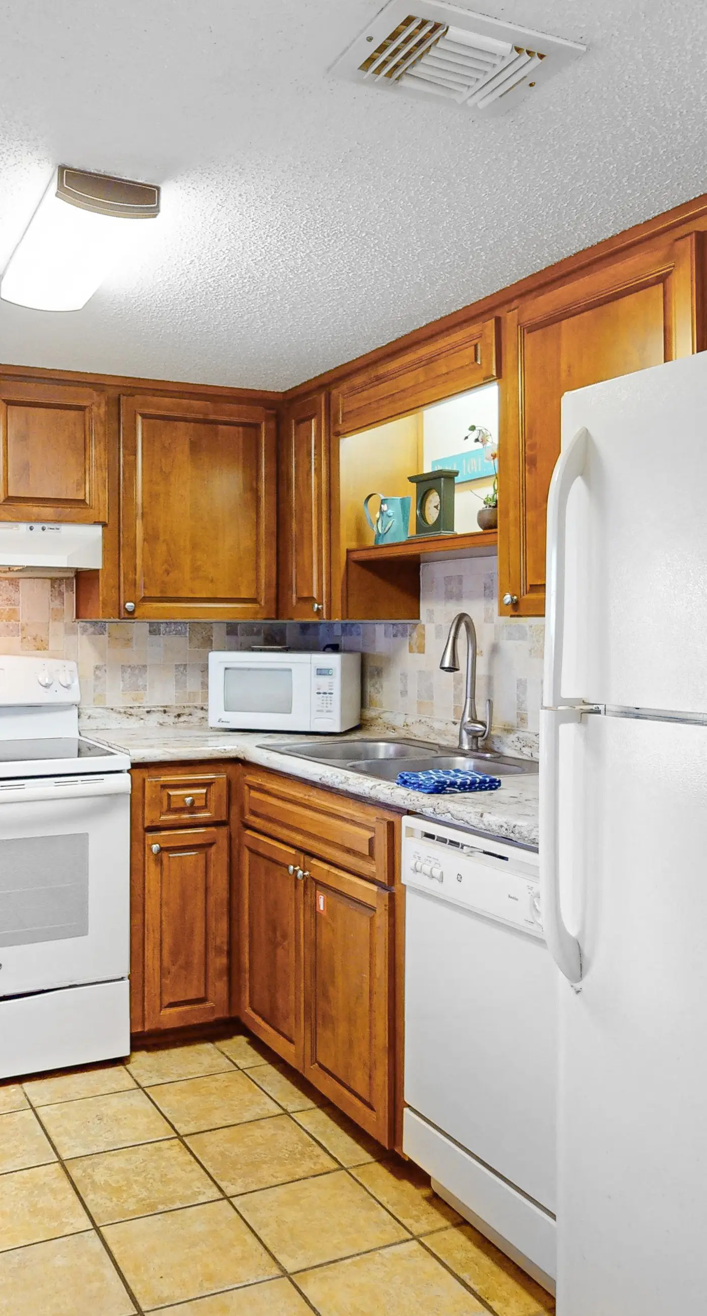 Convenient condo with balcony, beach views, pool, & central AC