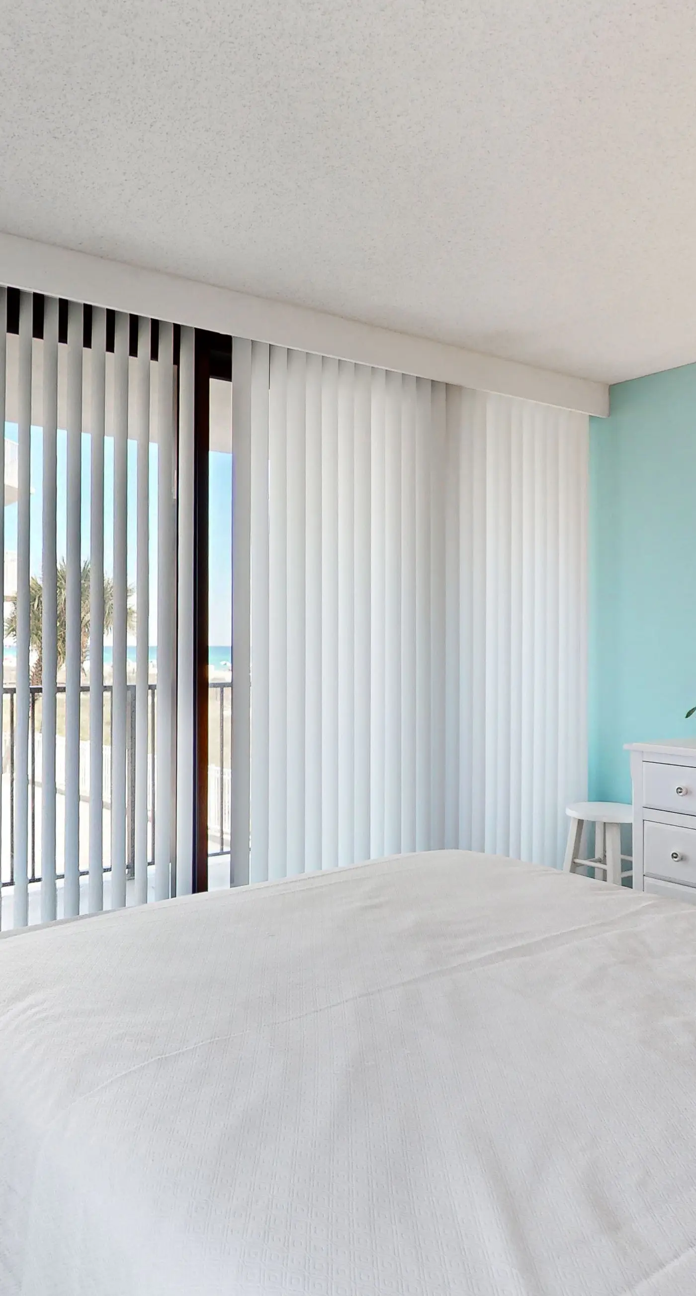 Convenient condo with balcony, beach views, pool, & central AC