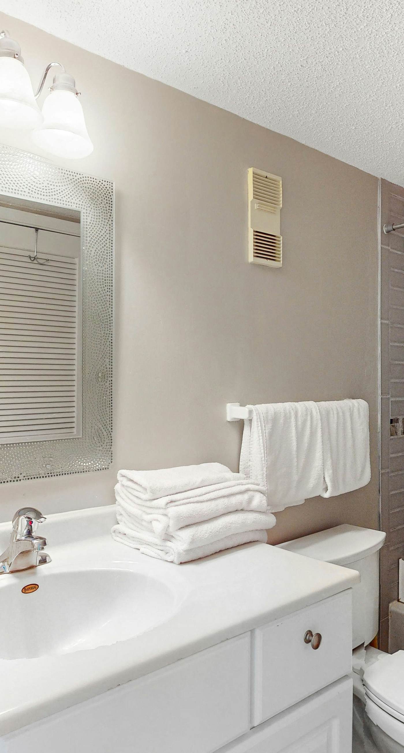 Convenient condo with balcony, beach views, pool, & central AC