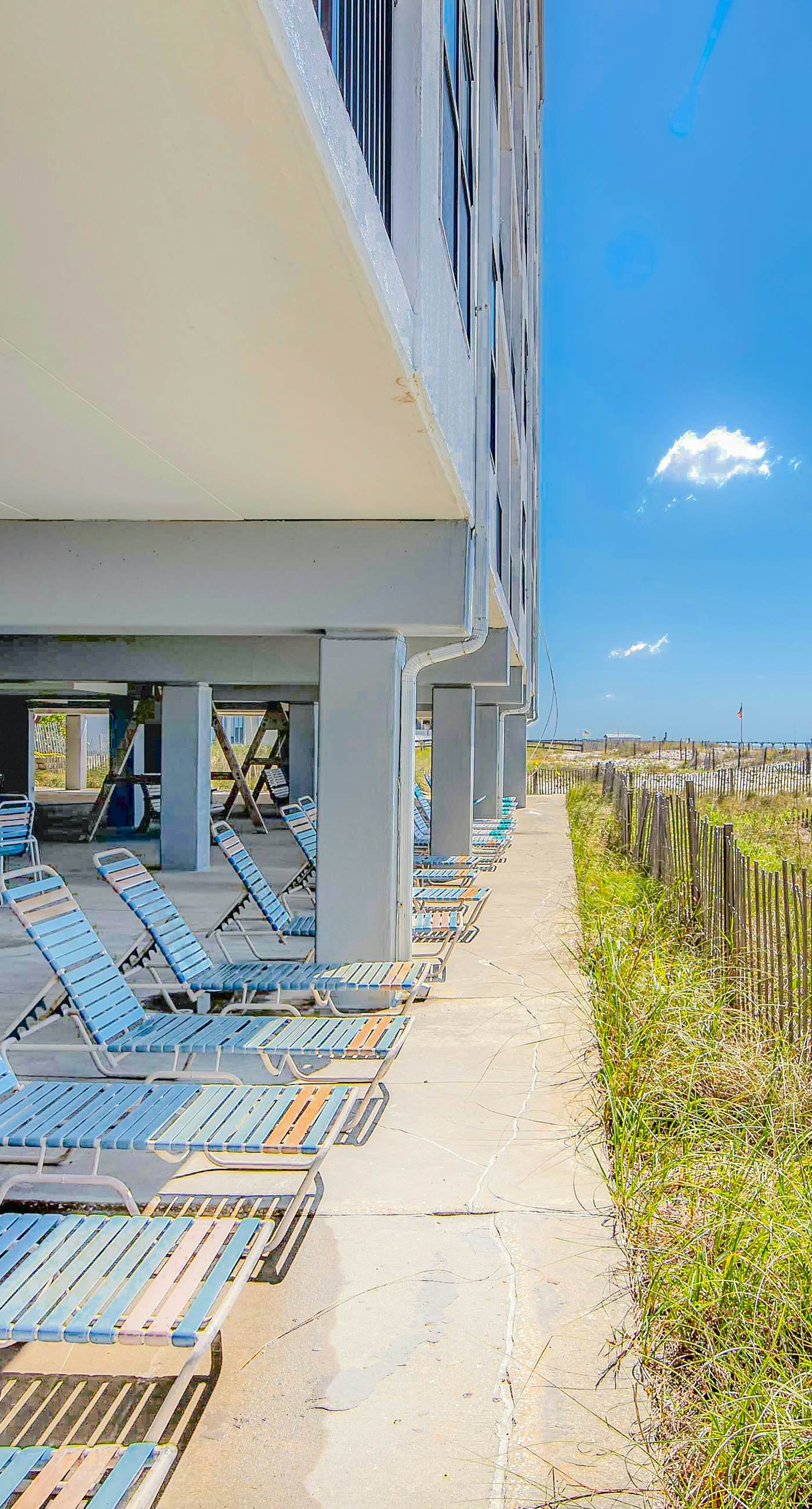 Convenient condo with balcony, beach views, pool, & central AC