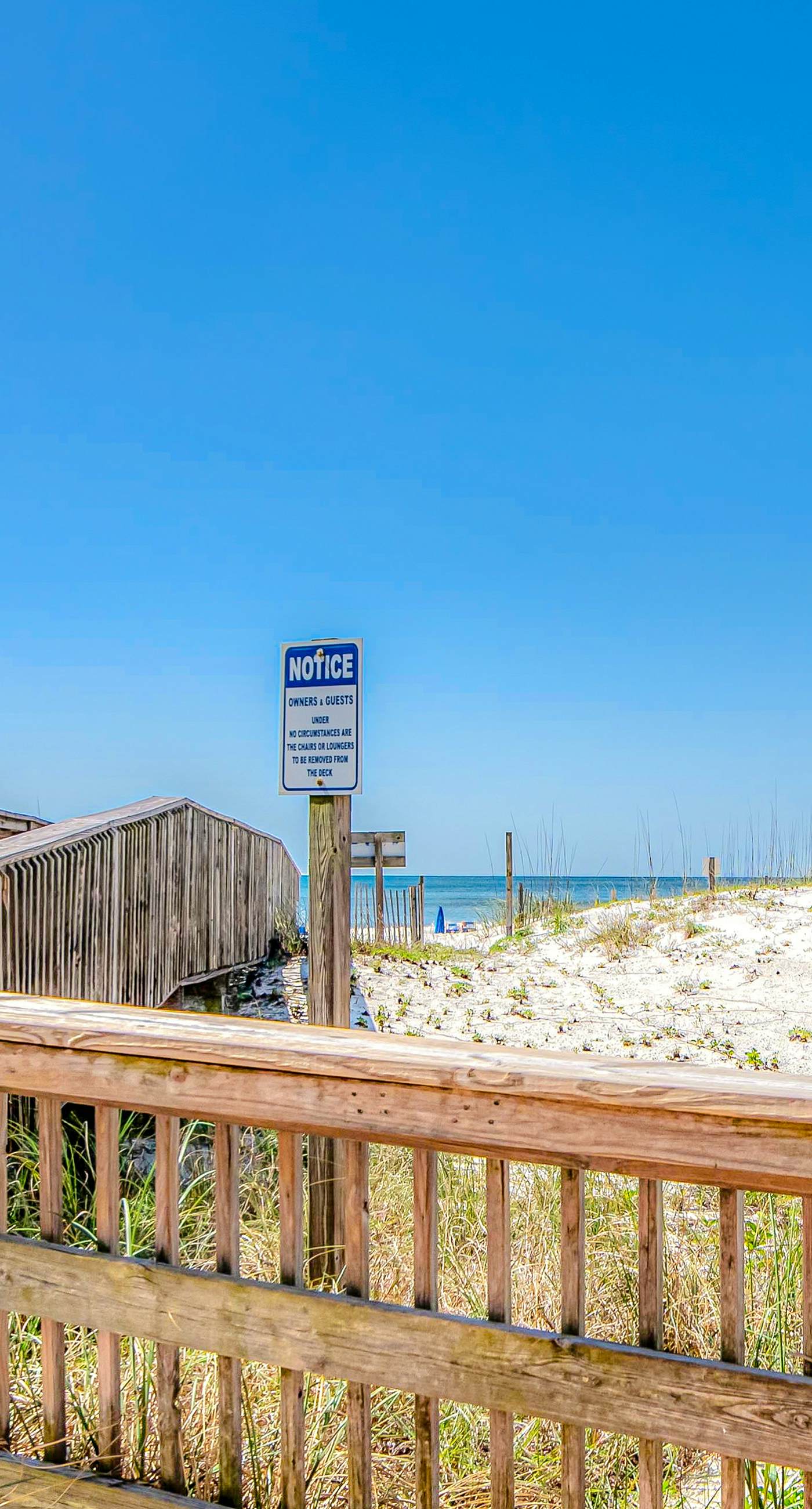 Convenient condo with balcony, beach views, pool, & central AC