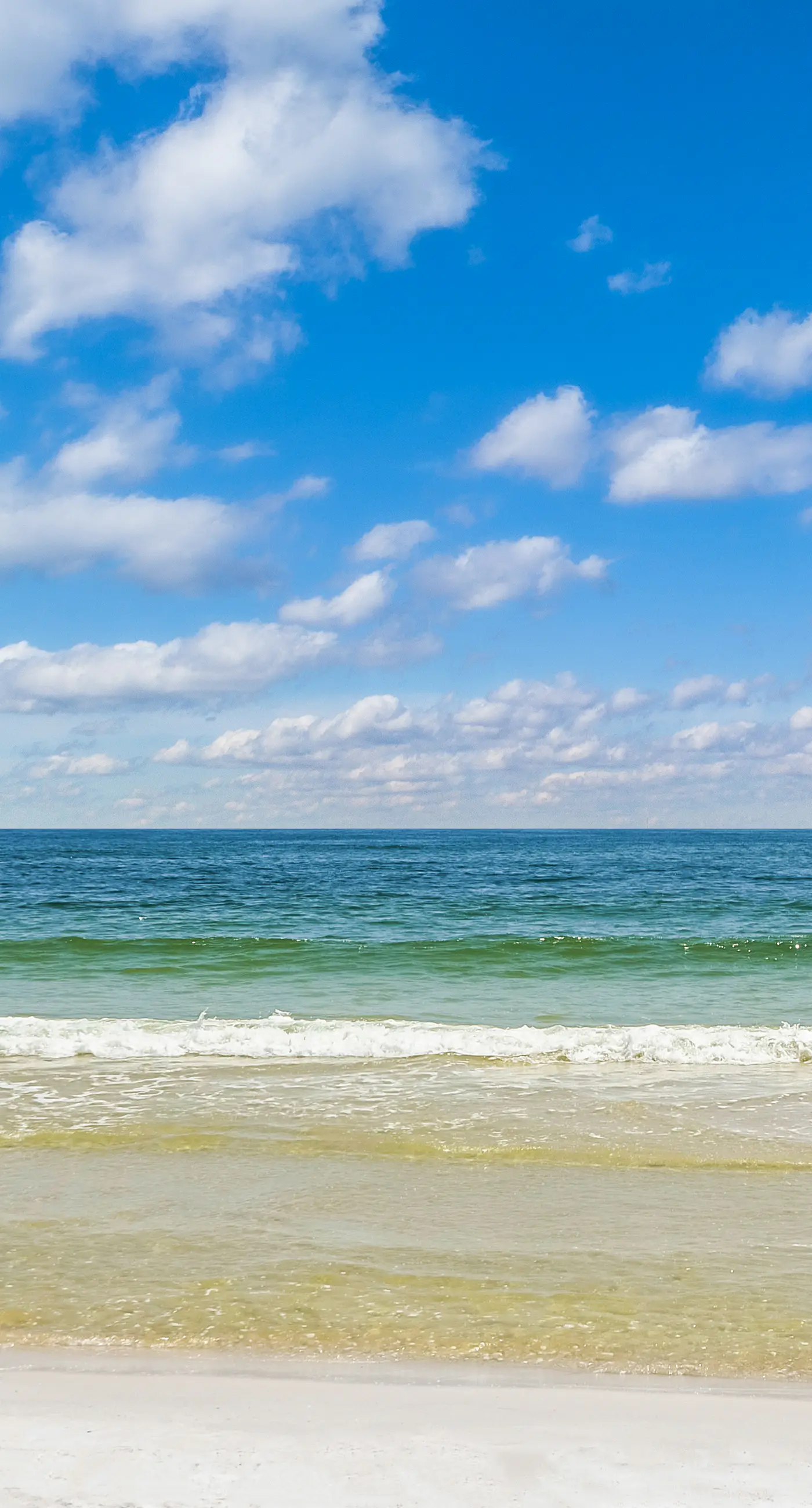 Convenient condo with balcony, beach views, pool, & central AC