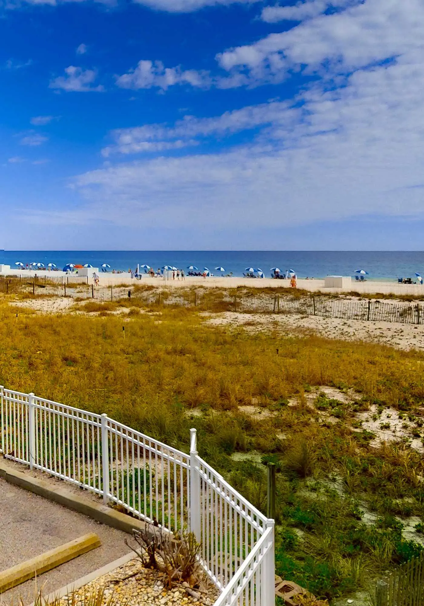 Convenient condo with balcony, beach views, pool, & central AC
