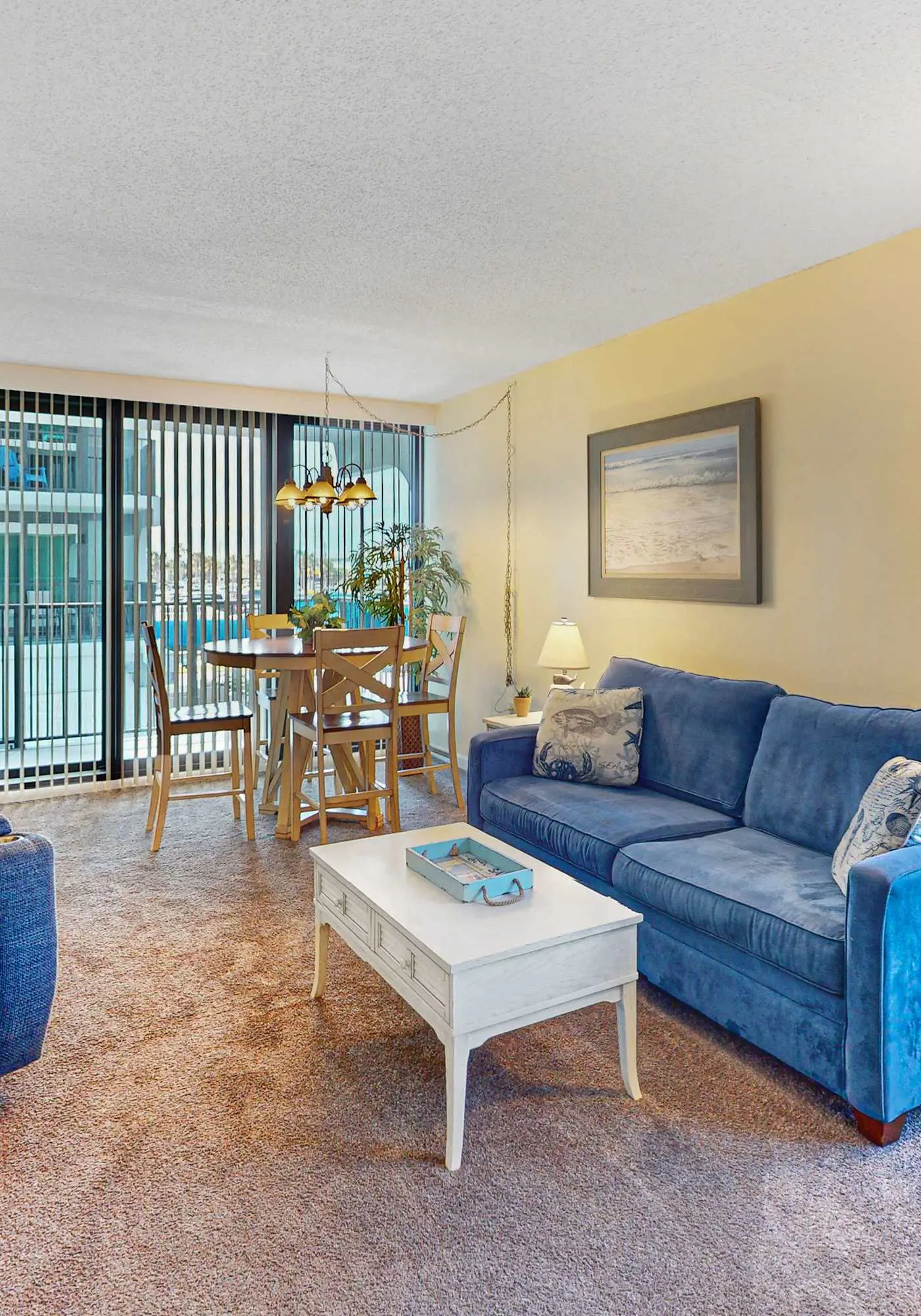 Convenient condo with balcony, beach views, pool, & central AC