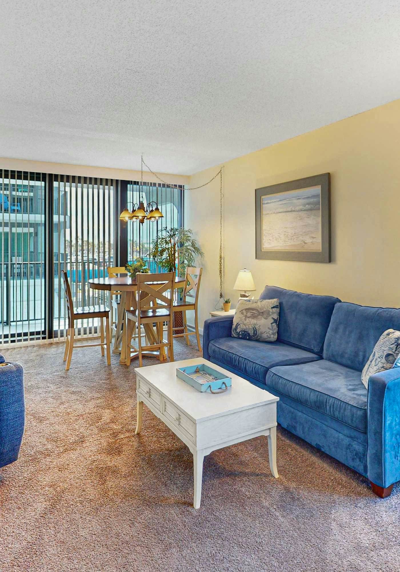 Convenient condo with balcony, beach views, pool, & central AC
