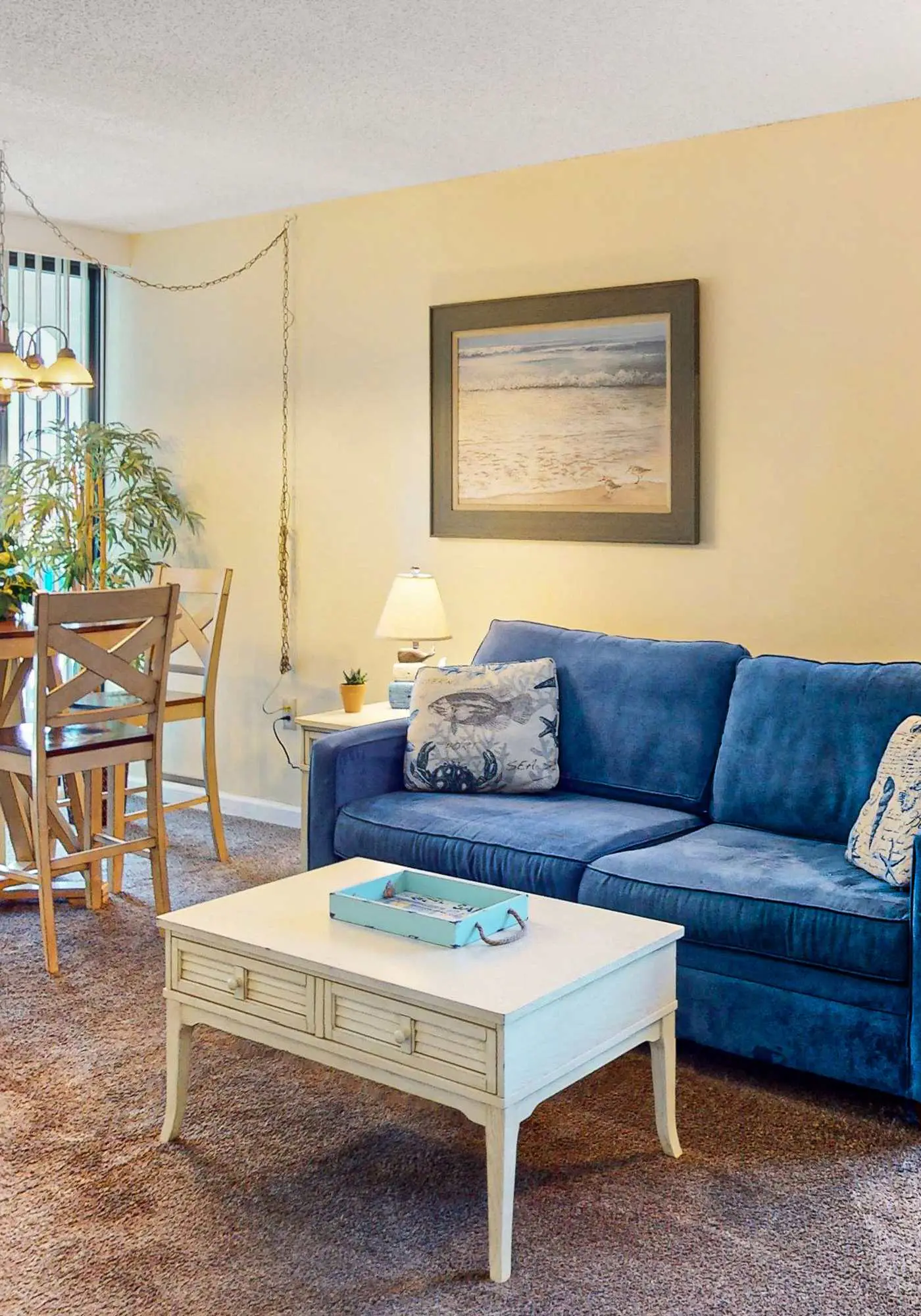 Convenient condo with balcony, beach views, pool, & central AC
