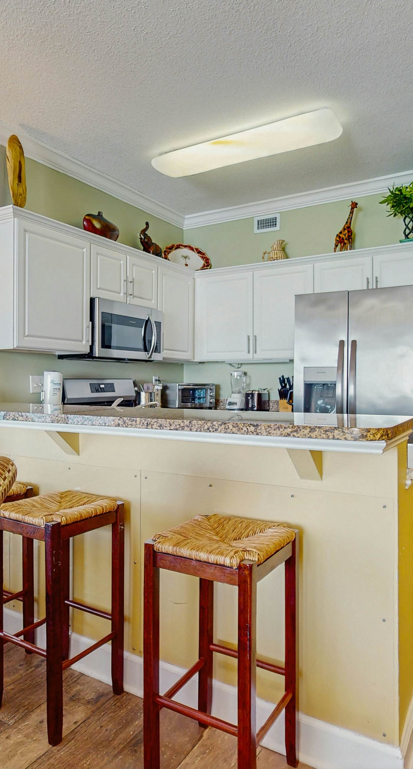 Family-friendly Gulf-front condo with private balcony, hot tub, pool, & gym