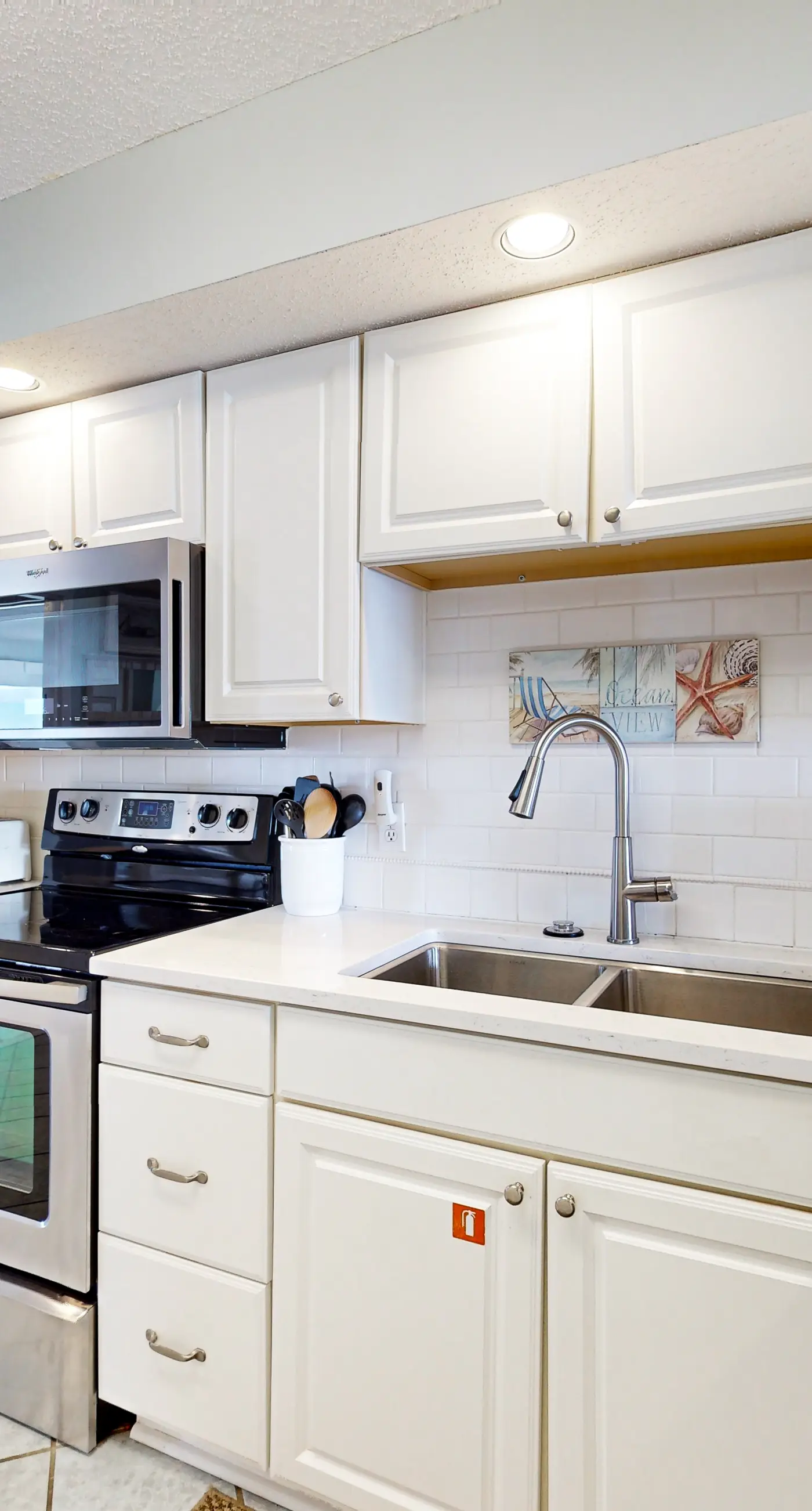 Gulf-front condo with beach views, balcony, central AC & pool