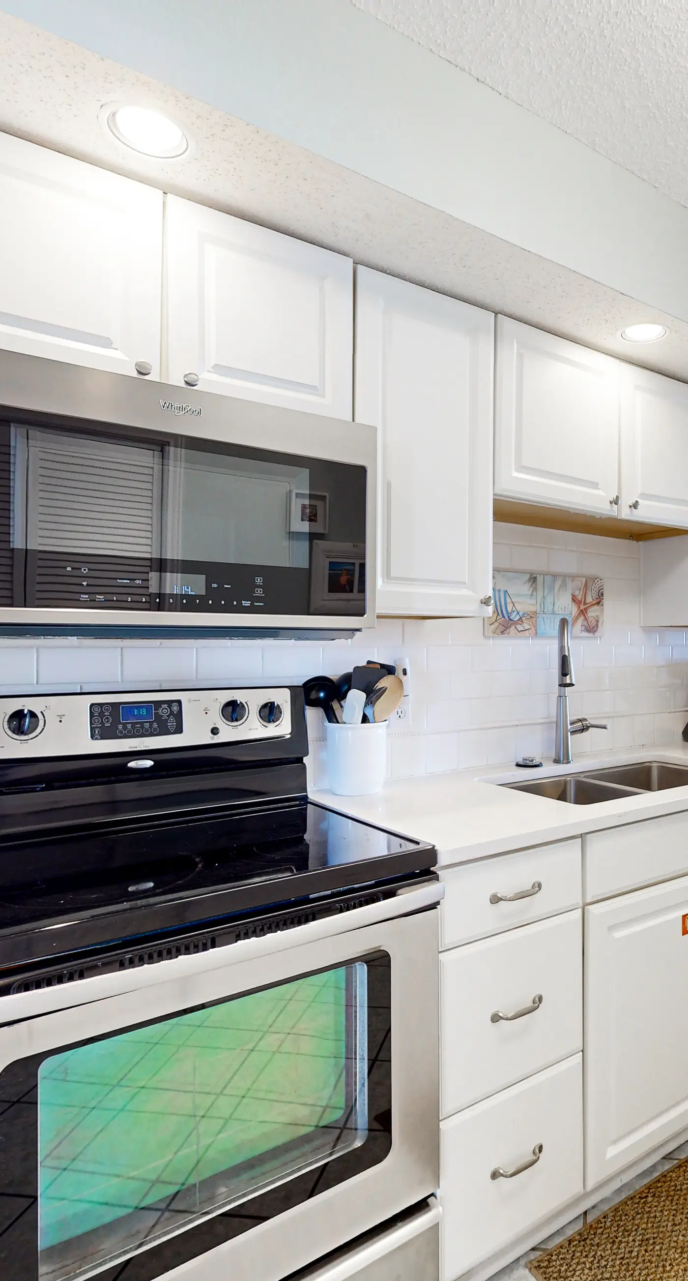 Gulf-front condo with beach views, balcony, central AC & pool