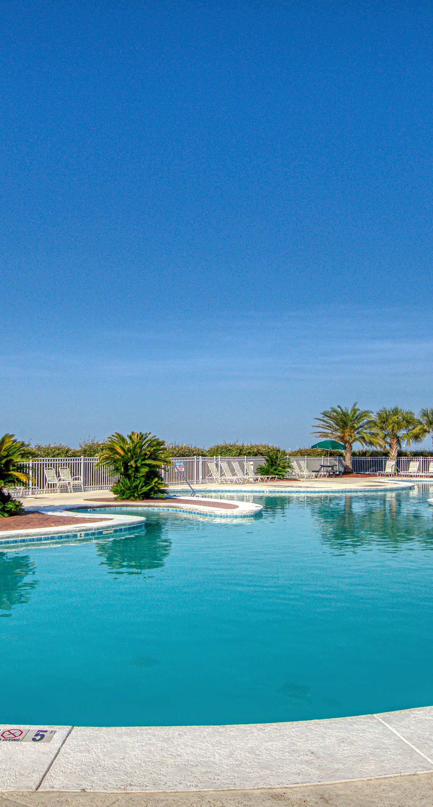 Duplex home with two-level deck, beach access, hot tub, & balcony