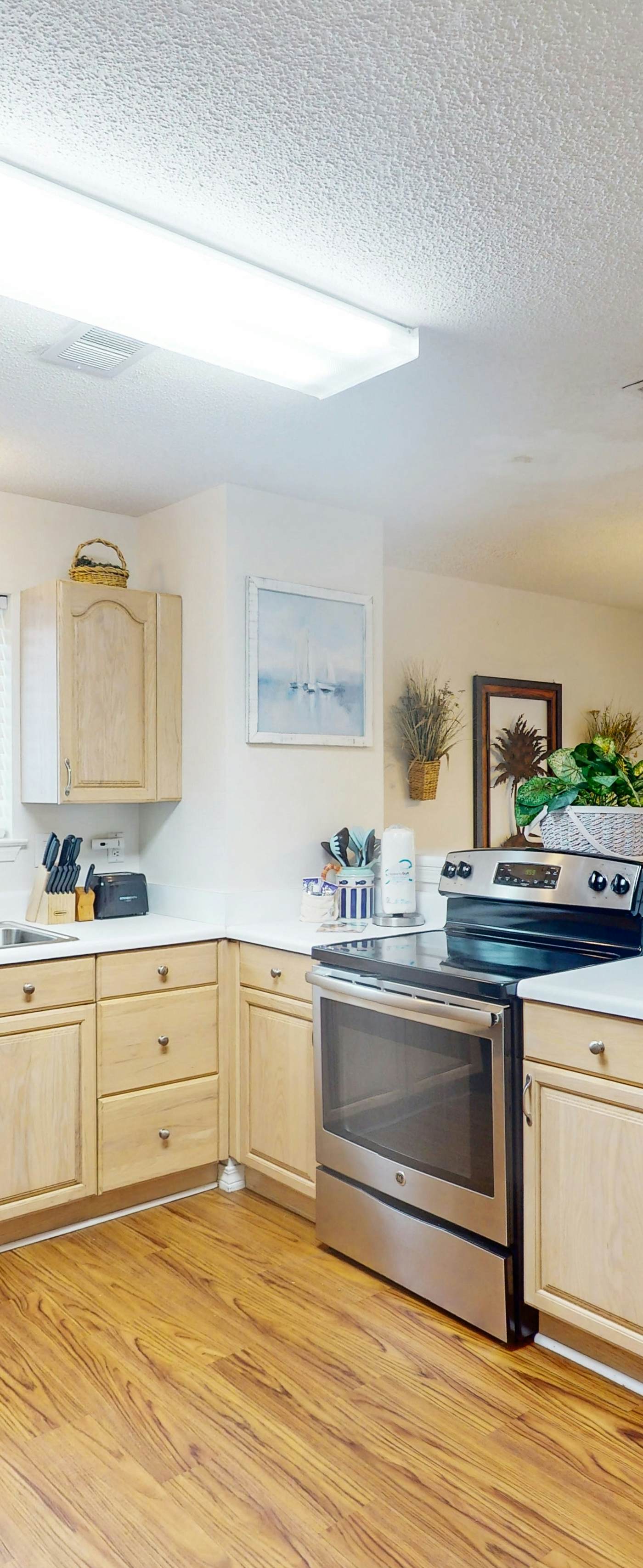 Duplex home with two-level deck, beach access, hot tub, & balcony